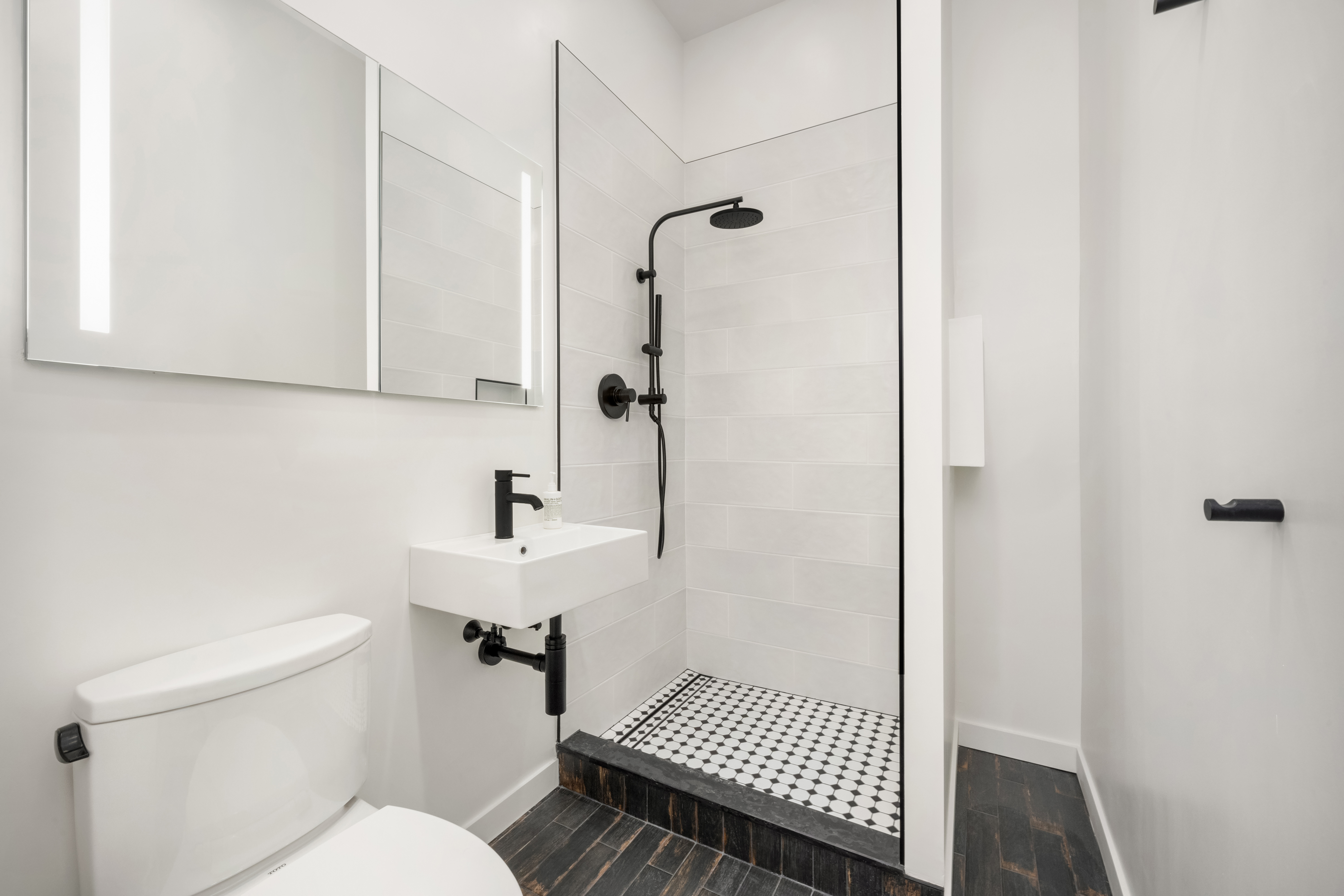 23 East 10th Street, Unit 3F Manhattan, NY 10003 - Photo 10 of 18 a bathroom with a sink toilet and shower