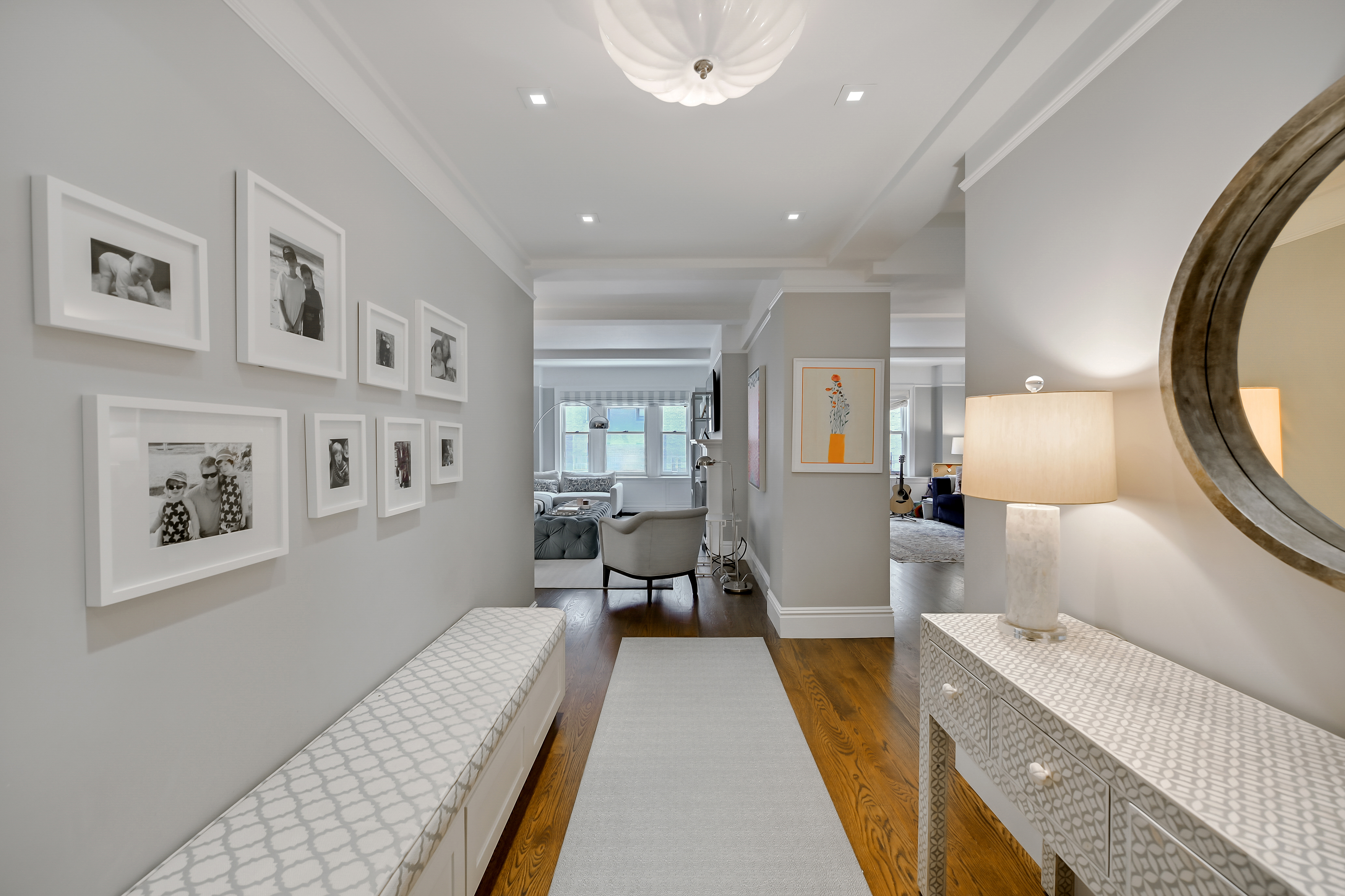 7 East 85th Street, Unit 5AB Manhattan, NY 10028 - Photo 11 of 12 a living room with furniture and a large window