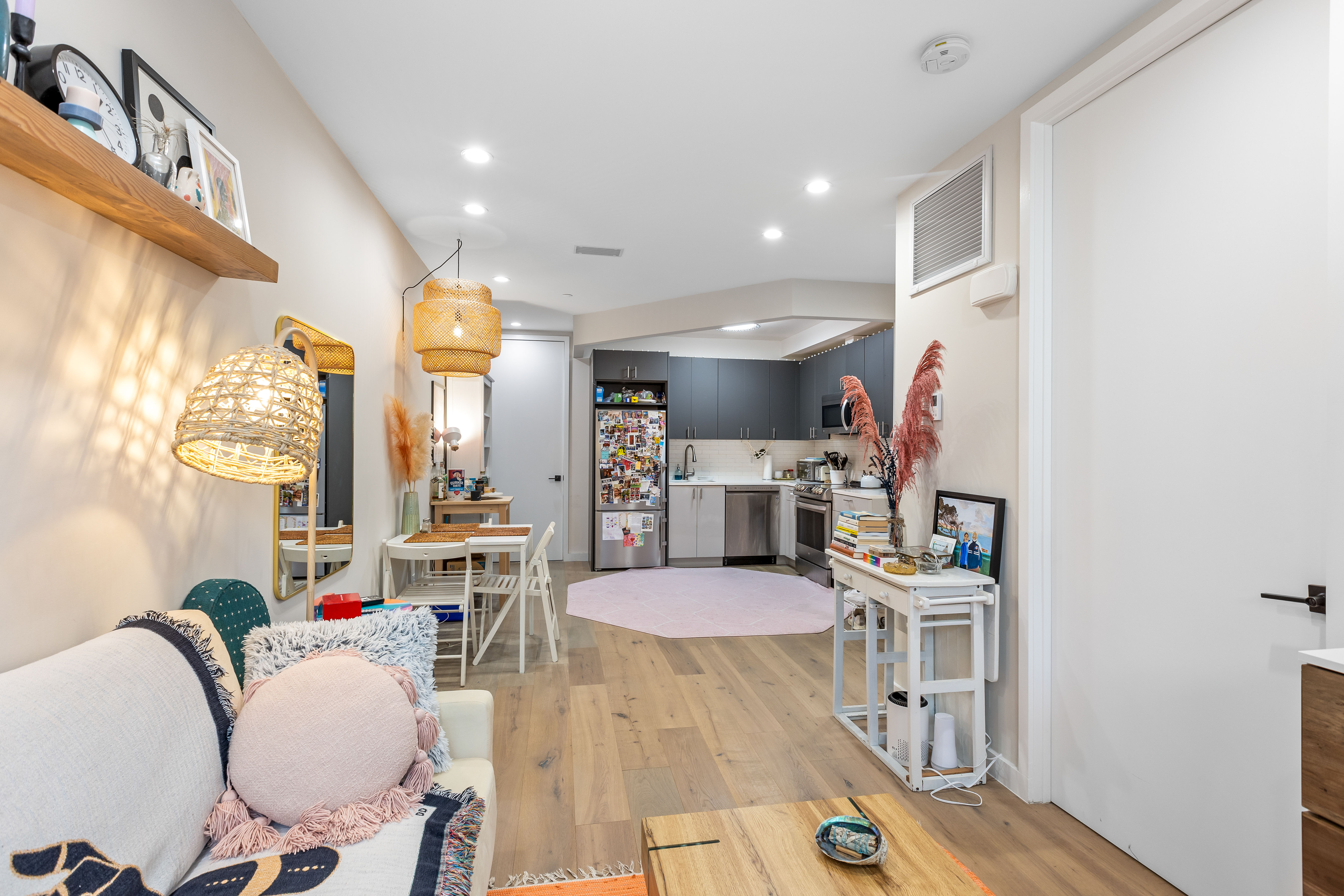 1390 Putnam Avenue, Unit 1F Brooklyn, NY 11221 - Photo 3 of 9 a living room with furniture and a table