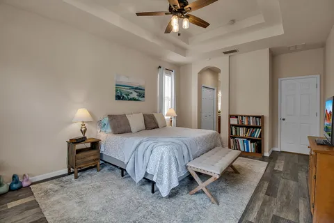 a bedroom with a bed and a book shelf