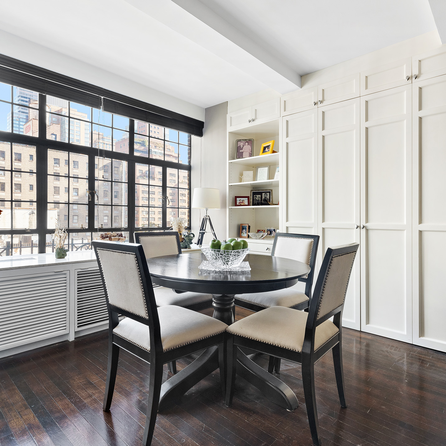 230 East 50th Street, Unit 9C Manhattan, NY 10022 - Photo 7 of 9 a view of a dining room with furniture window and wooden floor
