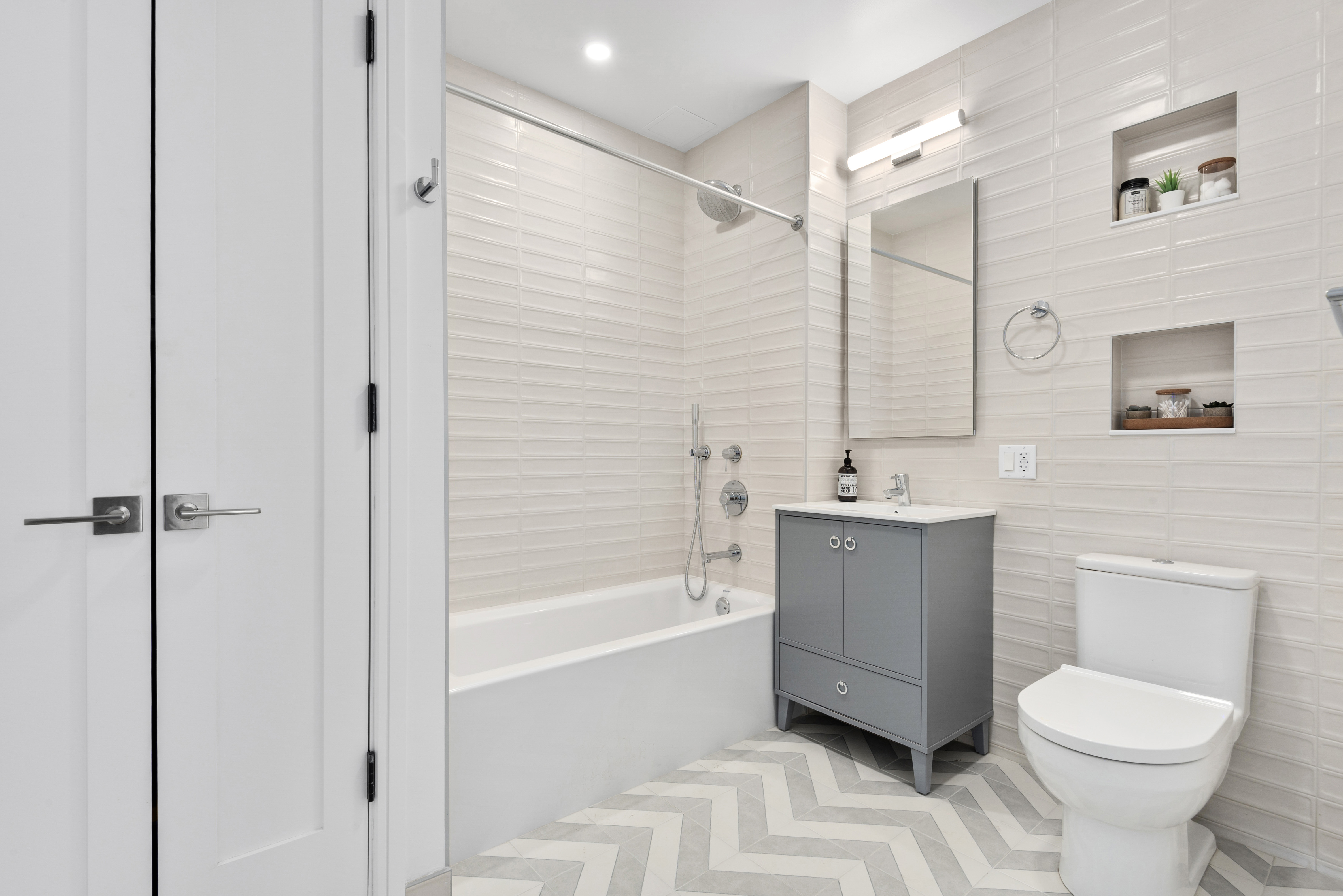 1 Lenox Road, Unit 3B Brooklyn, NY 11226 - Photo 4 of 9 a bathroom with a toilet a sink and bathtub