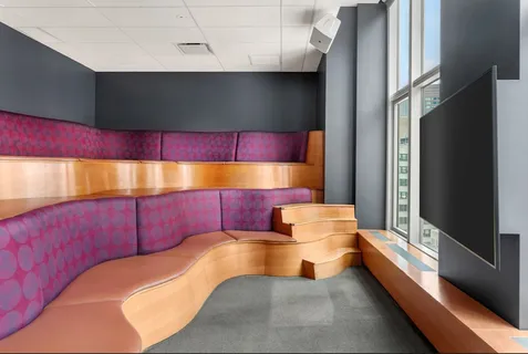 a bathroom with a bathtub and a potted plant