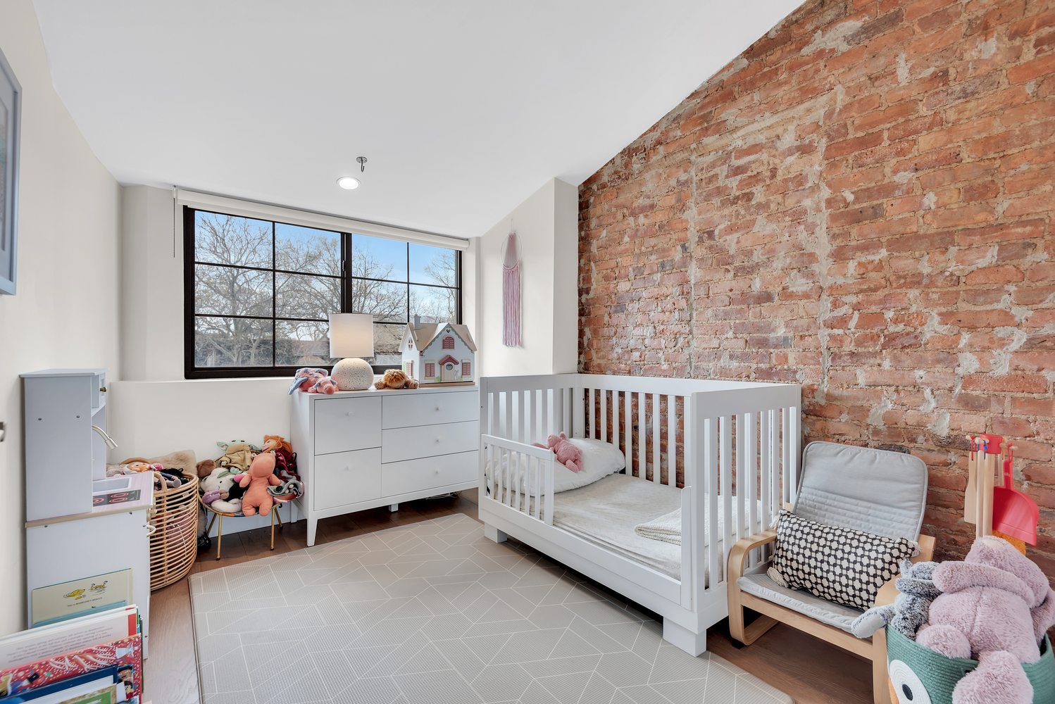541 Madison Street, Unit 4 Brooklyn, NY 11221 - Photo 7 of 9 a bedroom with furniture and a window