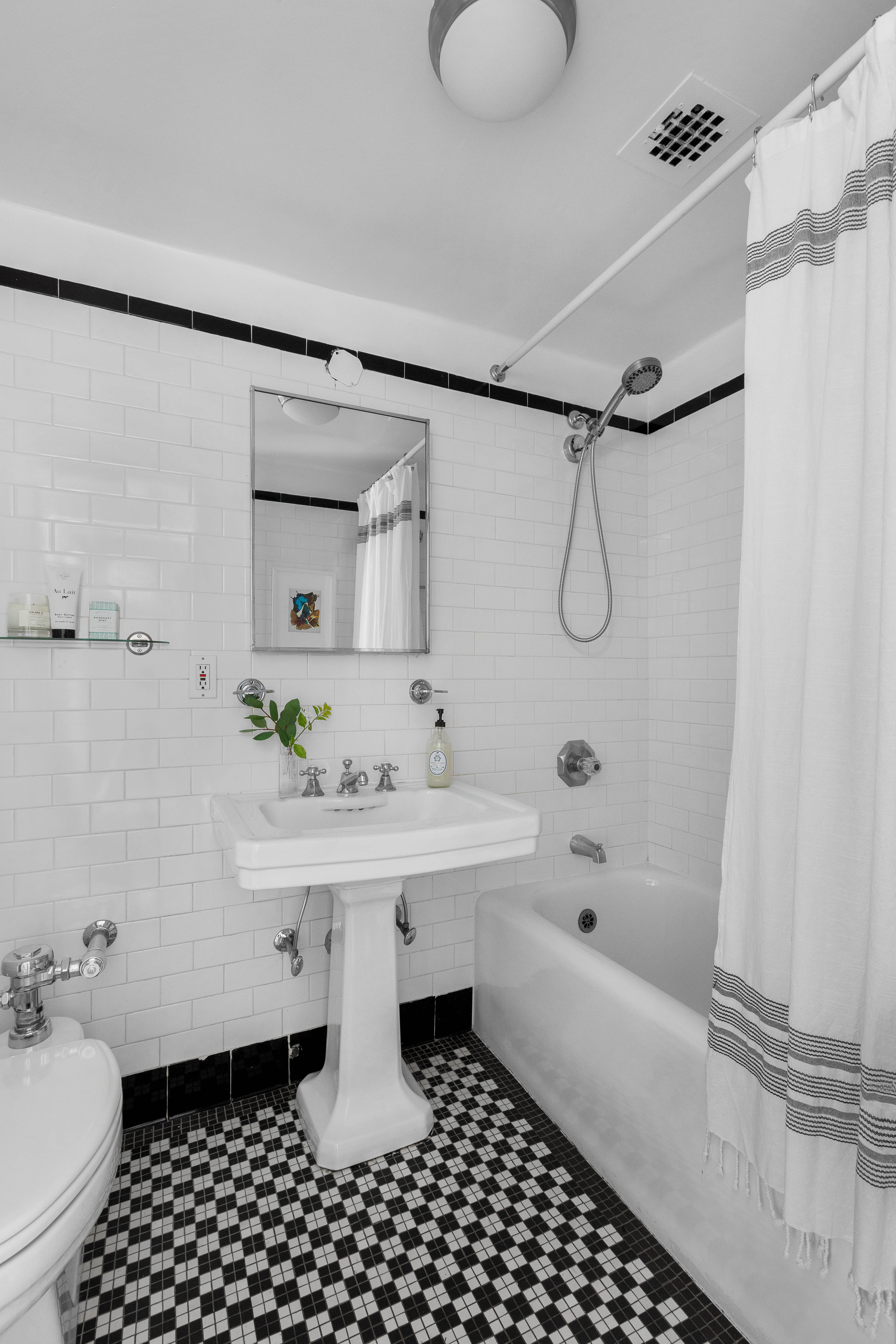 470 West 24th Street, Unit 16H Manhattan, NY 10011 - Photo 9 of 13 a bathroom with a sink toilet and shower