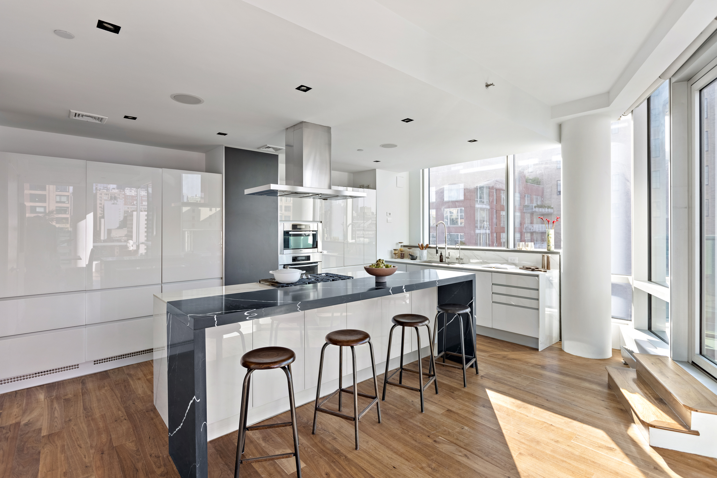 166 West 18th Street, Unit PH11 Manhattan, NY 10011 - Photo 5 of 16 a large kitchen with a table and chairs in it