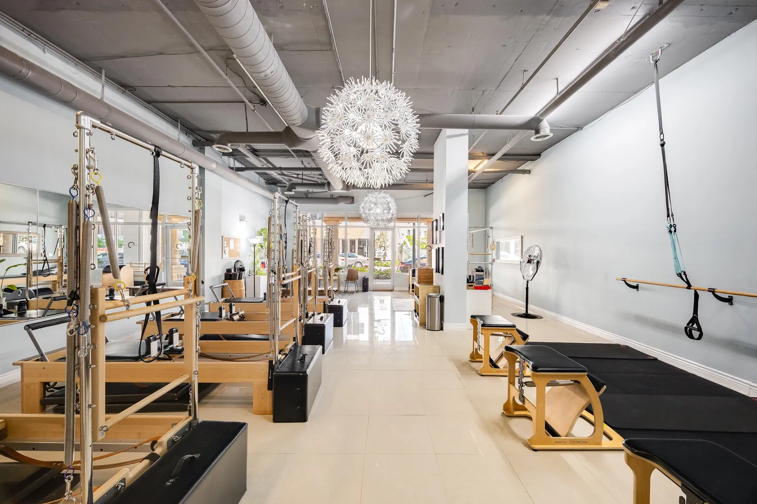 a living room with lots of furniture and chandelier
