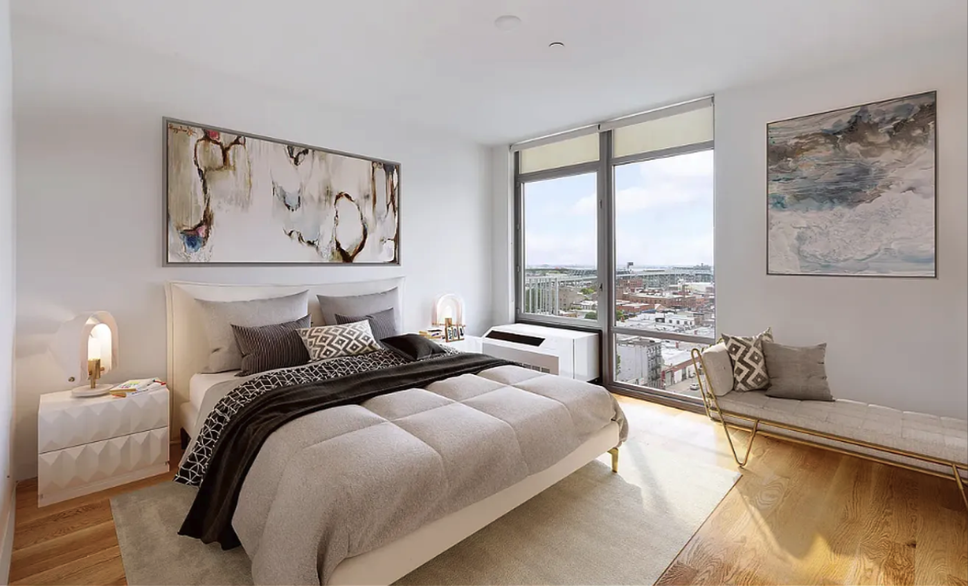 267 6th Street, Unit 6J Brooklyn, NY 11215 - Photo 2 of 15 a bedroom with bed and glass window