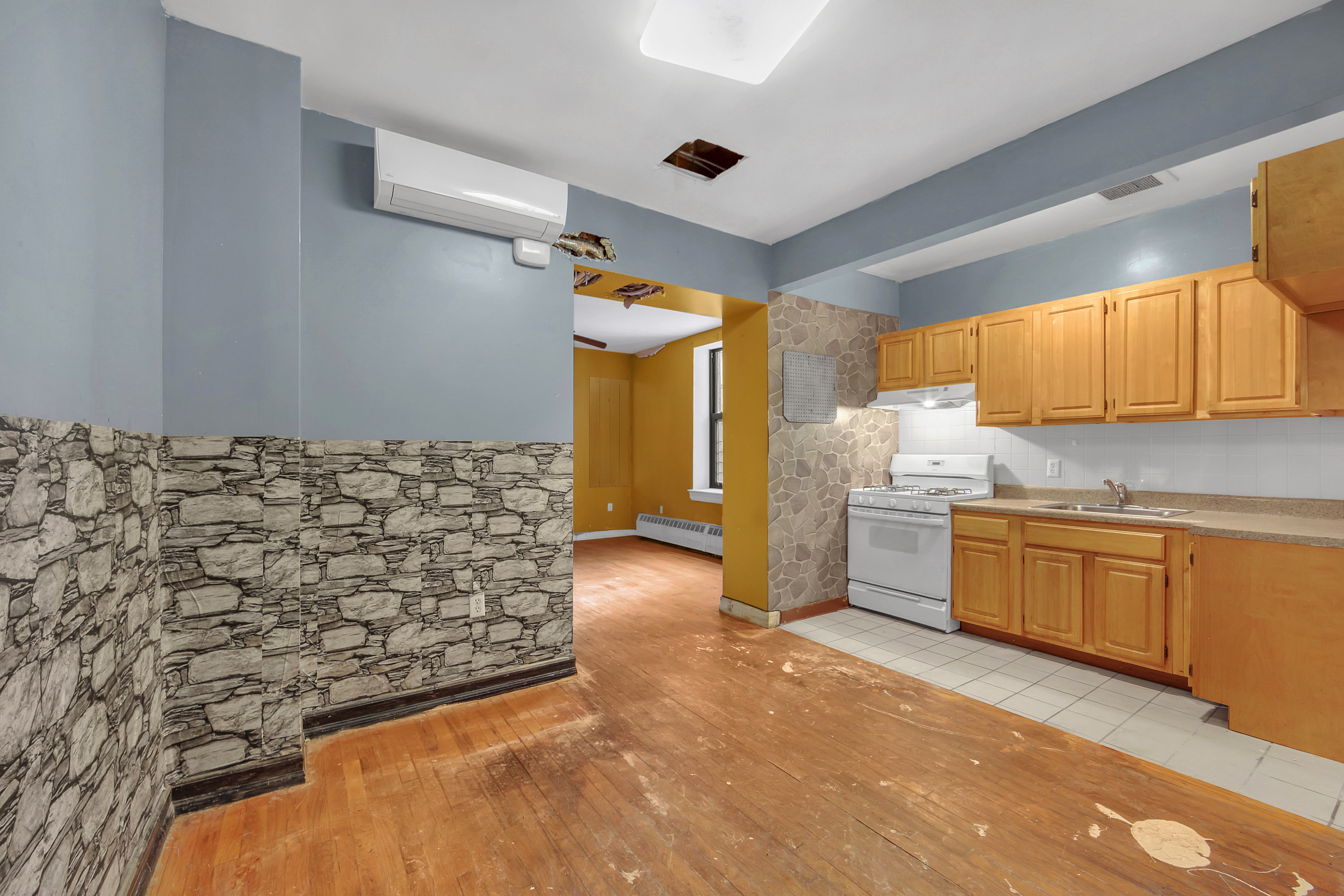 430 Lenox Avenue, Unit 1 Manhattan, NY 10037 - Photo 7 of 14 a bathroom with a sink and a mirror