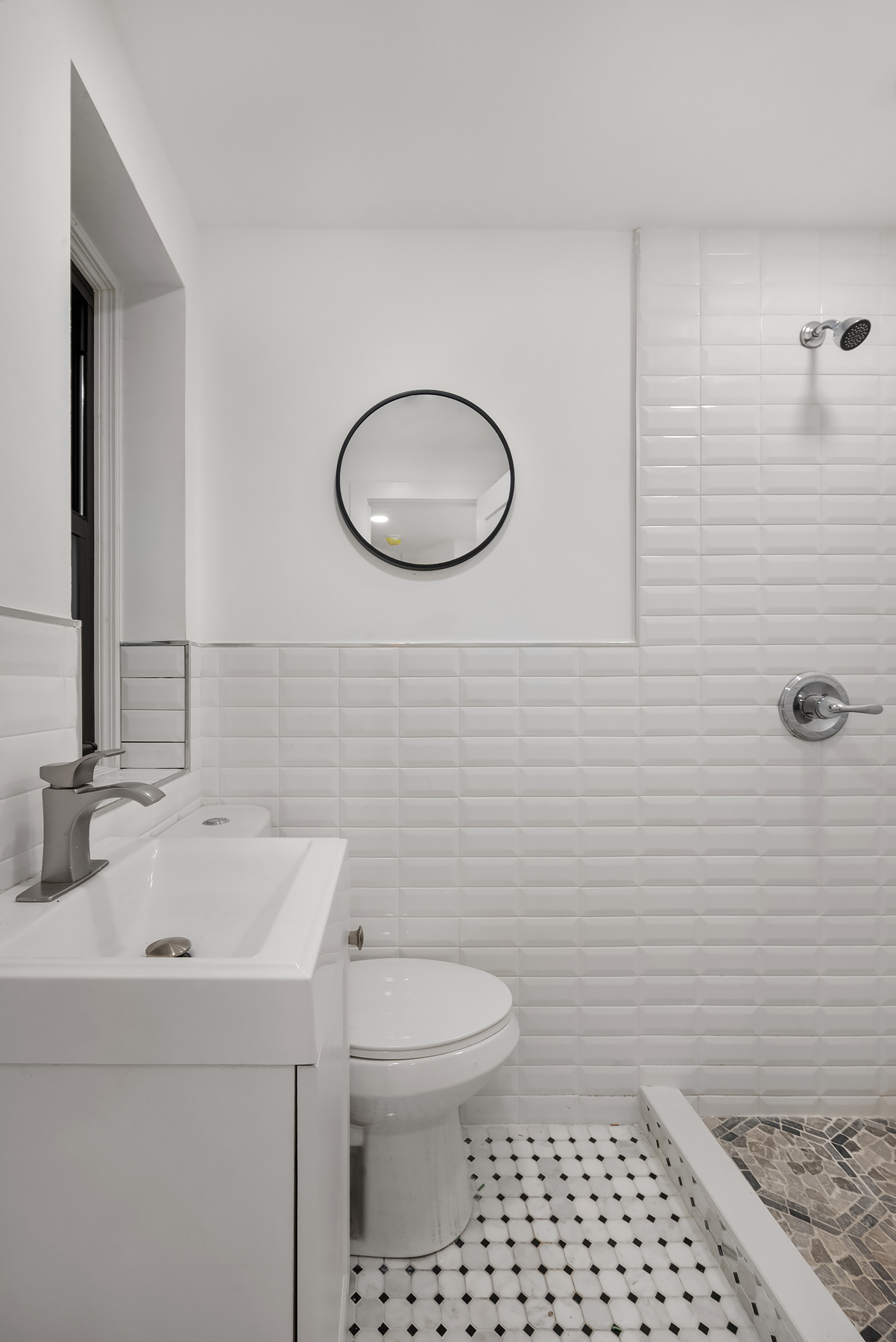 317 East 73rd Street, Unit 4RE Manhattan, NY 10021 - Photo 5 of 8 a bathroom with a sink toilet and shower