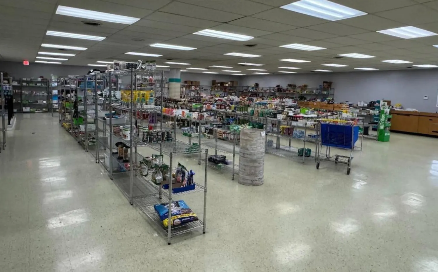 a view of a hallway with seating area
