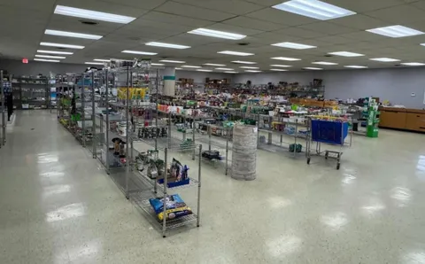 a view of a hallway with seating area