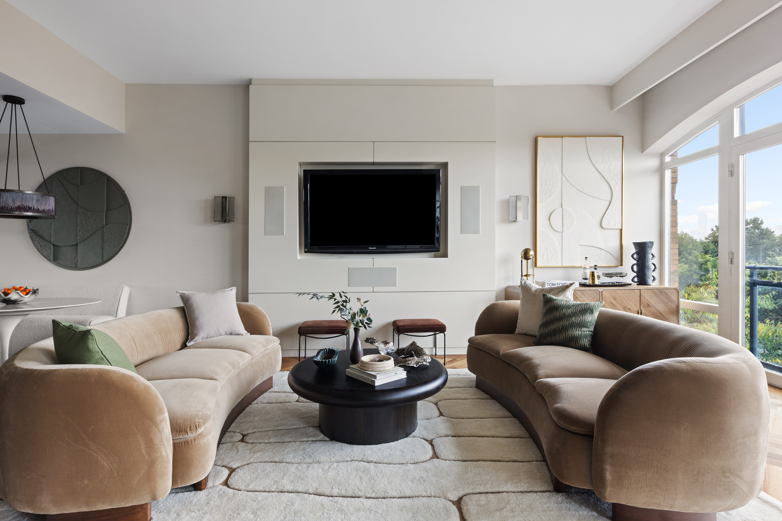 400 West 12th Street, Unit 4E Manhattan, NY 10014 - Photo 5 of 24 a living room with furniture and a flat screen tv