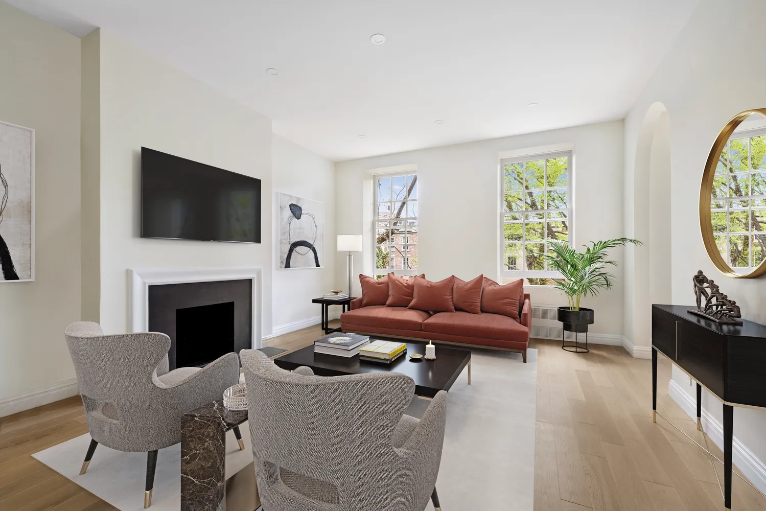 a living room with furniture a fireplace and a flat screen tv