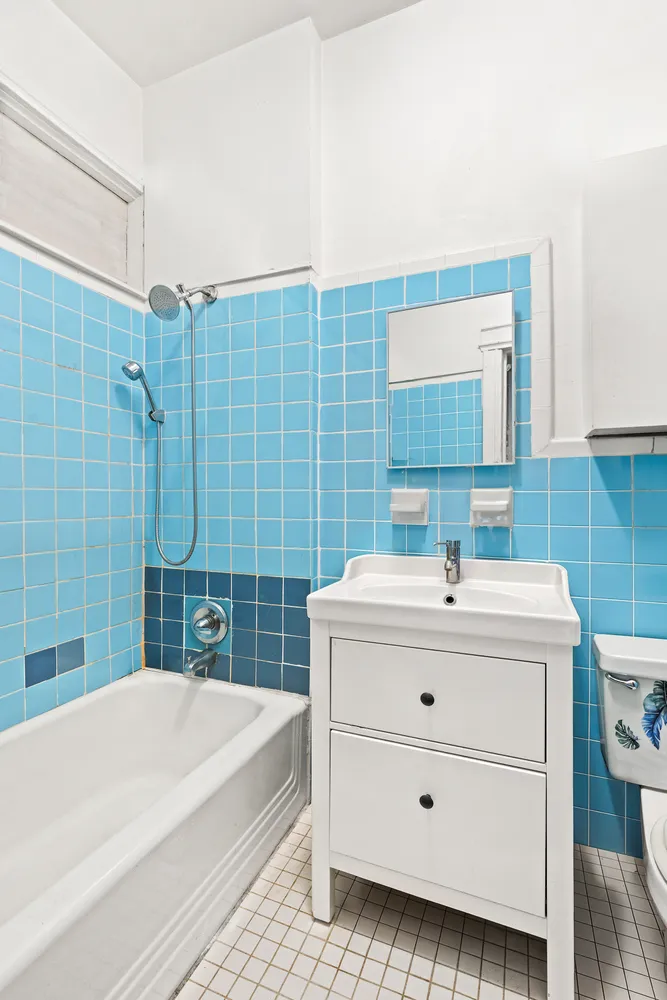 a bathroom with a sink a mirror and a bathtub