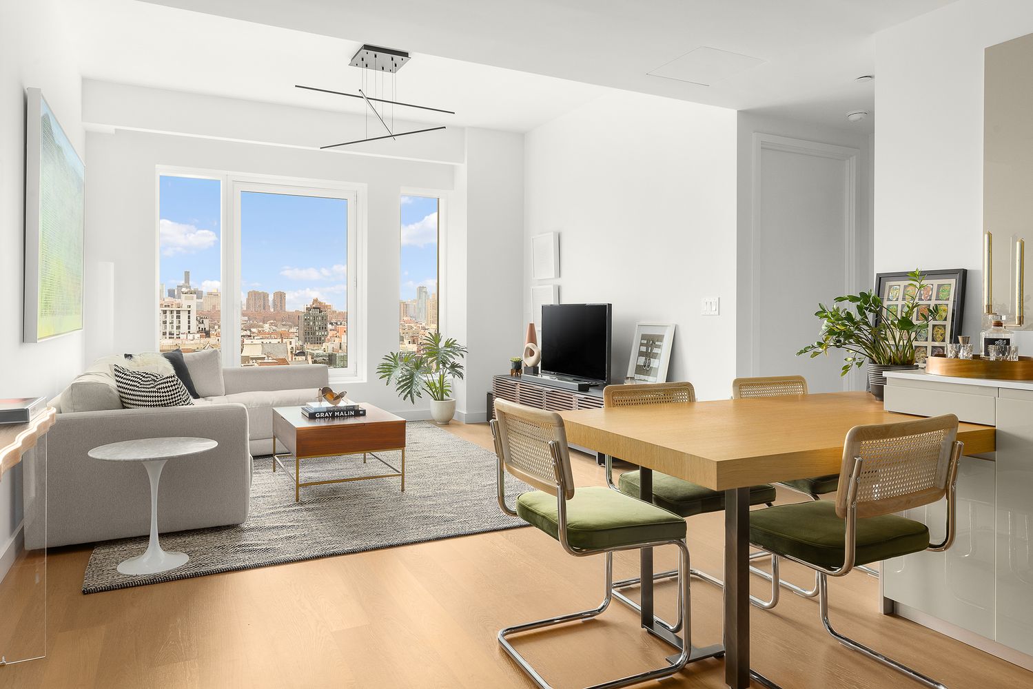 a view of a livingroom with furniture and a flat screen tv