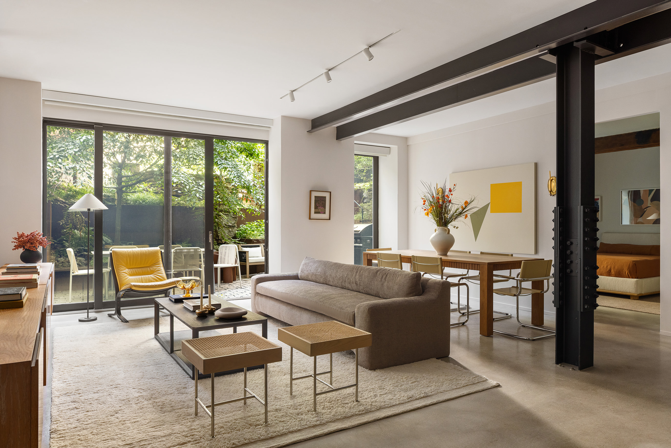 168 Plymouth Street, Unit GARDEN Brooklyn, NY 11201 - Photo 2 of 23 a living room with furniture and large windows