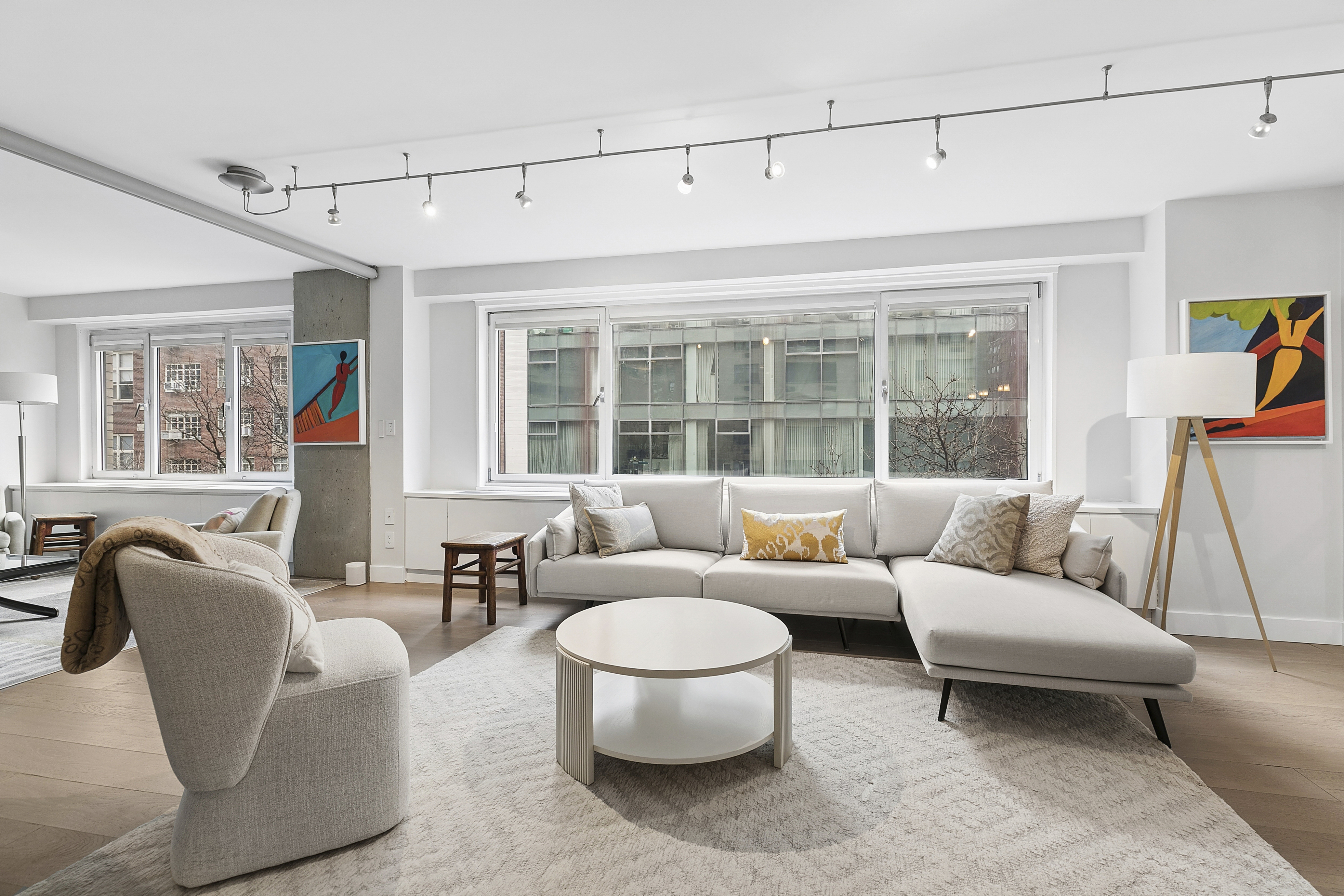 1065 Park Avenue, Unit 4BC Manhattan, NY 10128 - Photo 2 of 16 a living room with furniture and a large window