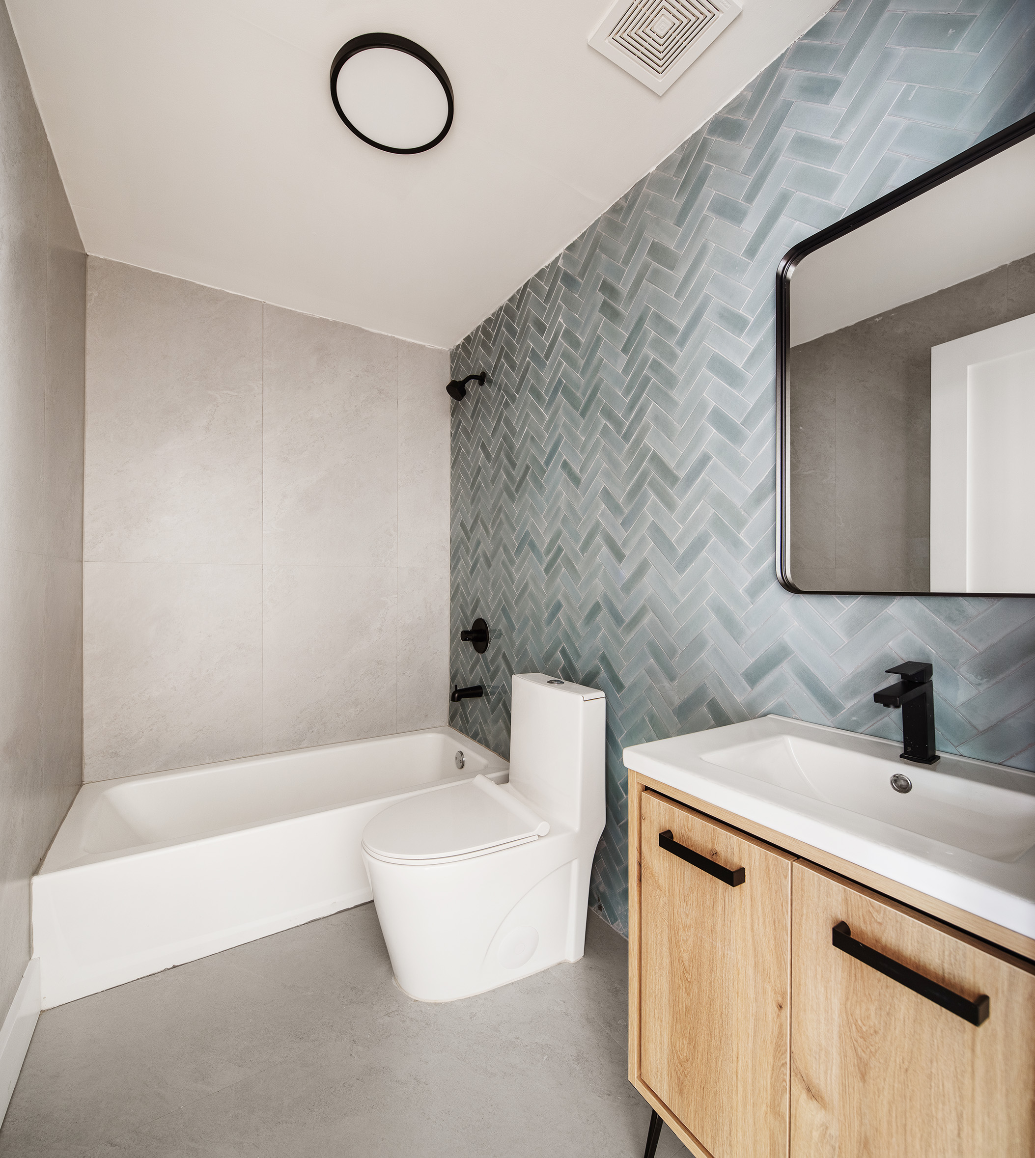 405 Herkimer Street, Unit 3 Brooklyn, NY 11213 - Photo 4 of 8 a bathroom with a sink a toilet a mirror and vanity