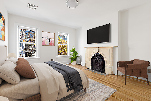 993 Lorimer Street, Unit 2 Brooklyn, NY 11222 - Photo 9 of 15 a bedroom with a bed and a flat screen tv