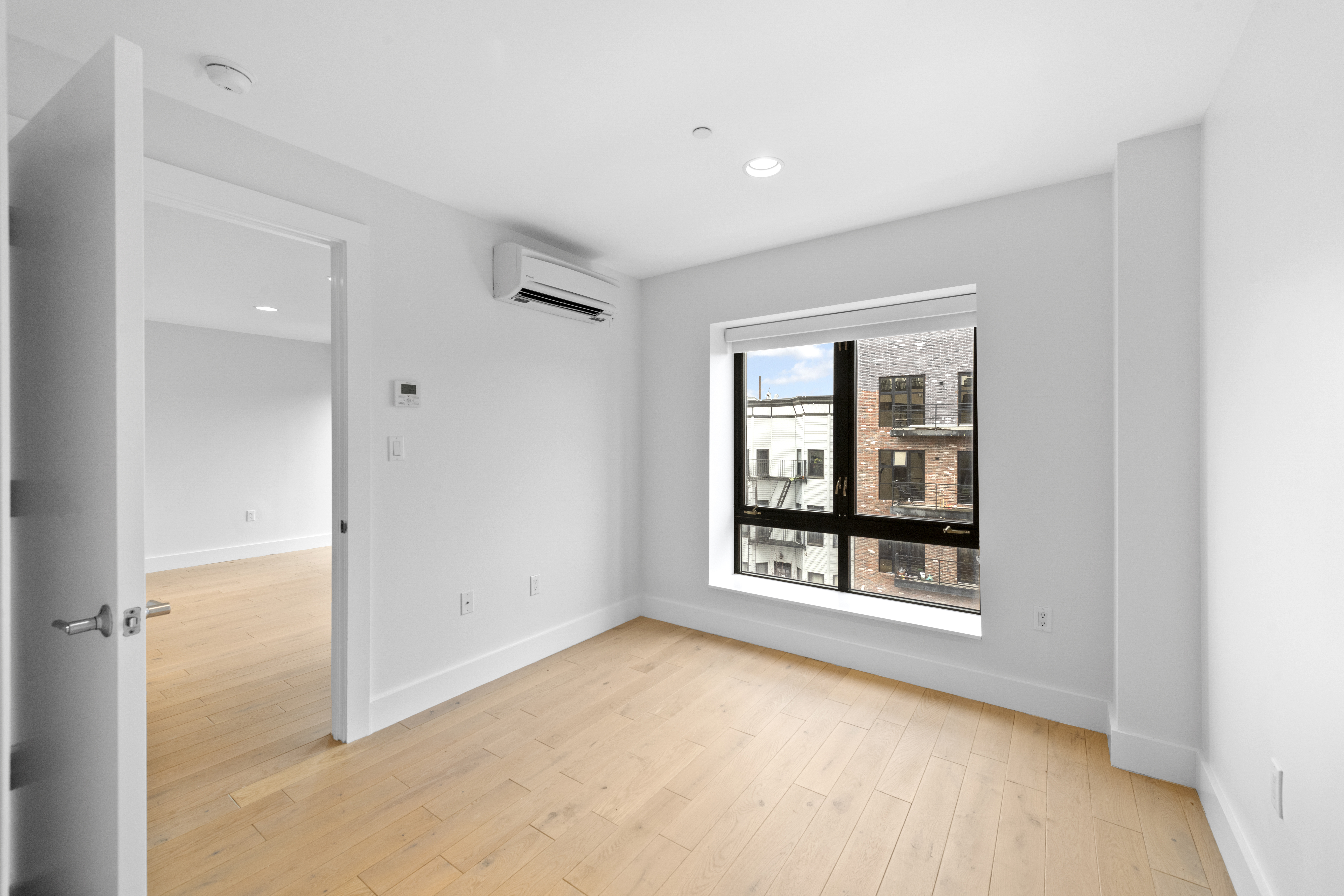 1164 Greene Avenue, Unit PHB Brooklyn, NY 11221 - Photo 5 of 16 an empty room with windows and closet