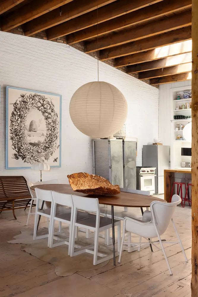 a dinning table and chairs in a room