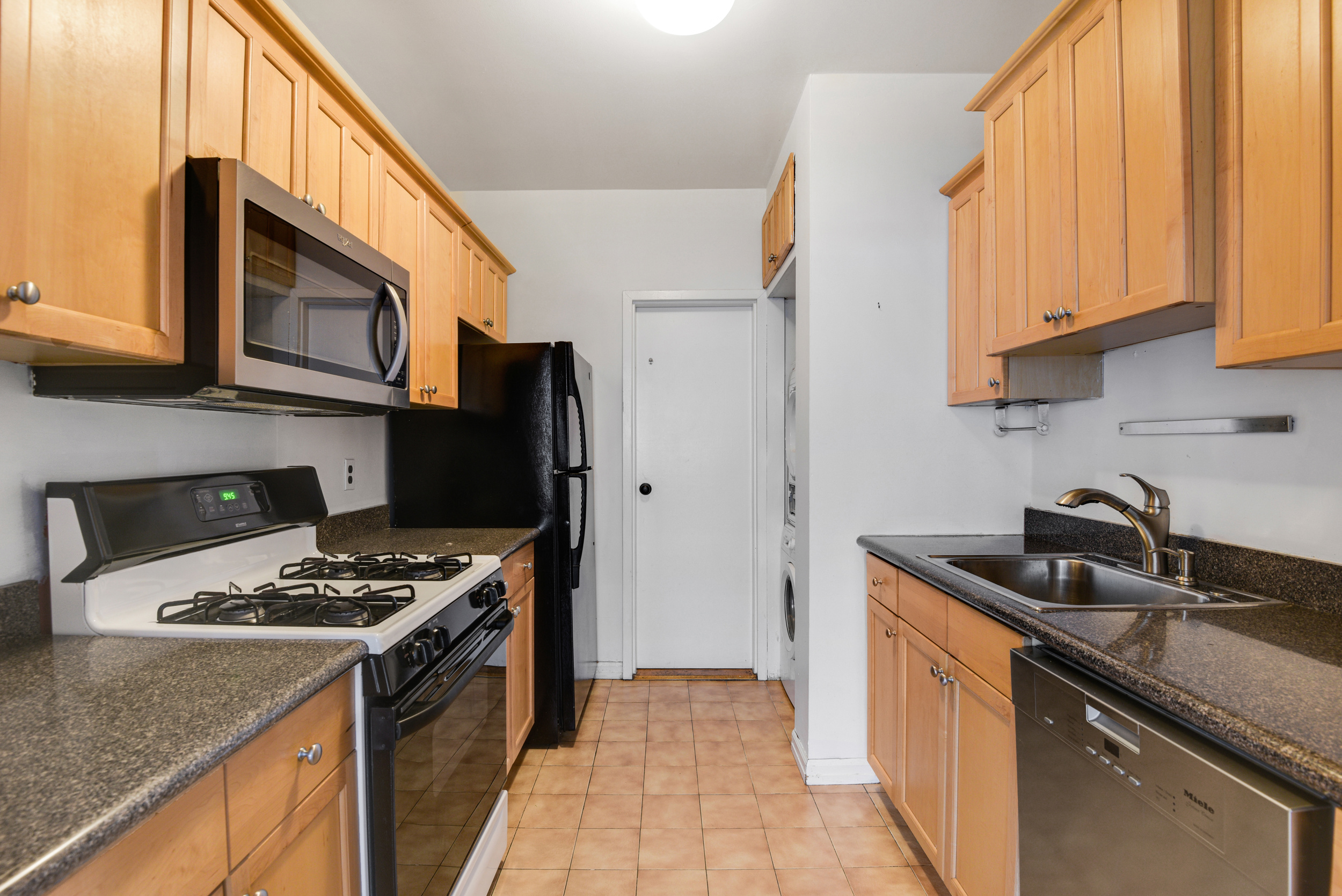 492 Henry Street, Unit 2A Brooklyn, NY 11231 - Photo 7 of 13 a kitchen with stainless steel appliances granite countertop a stove a sink and a refrigerator