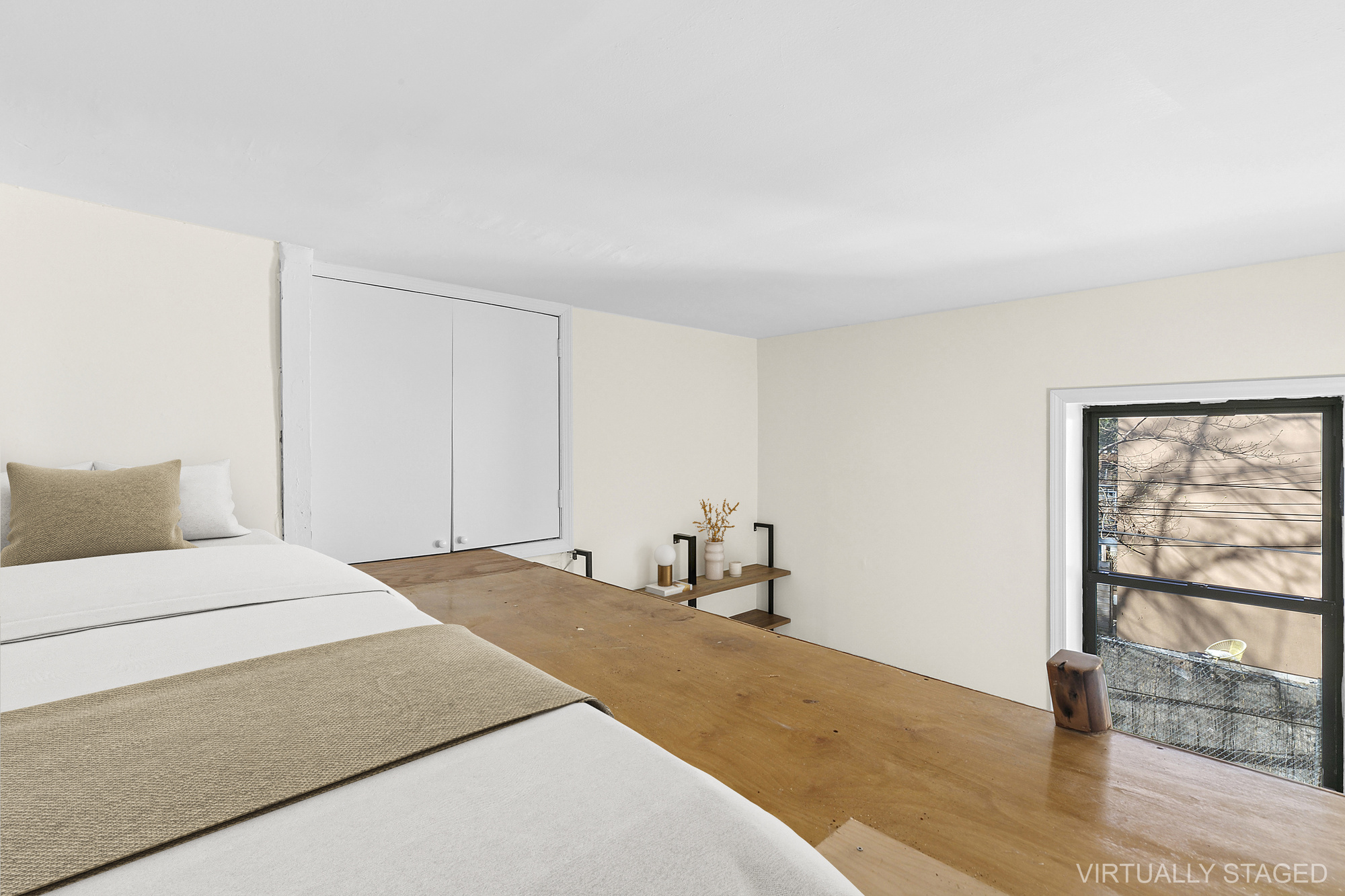 1100 Dean Street, Unit 4 Brooklyn, NY 11216 - Photo 8 of 13 a bedroom with a bed and a large window