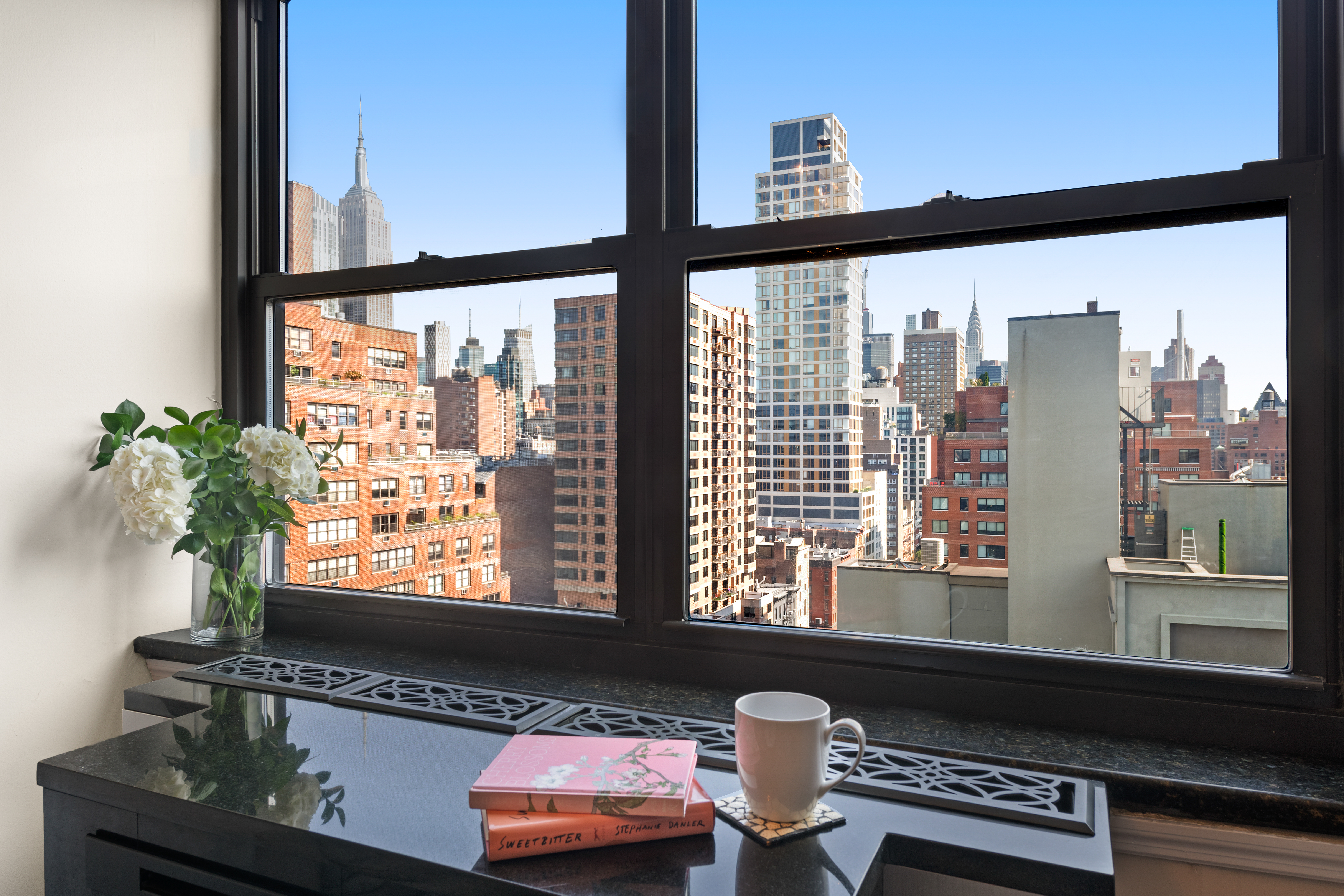 200 East 24th Street, Unit 1807 Manhattan, NY 10010 - Photo 9 of 10 a view of a window with an outdoor space