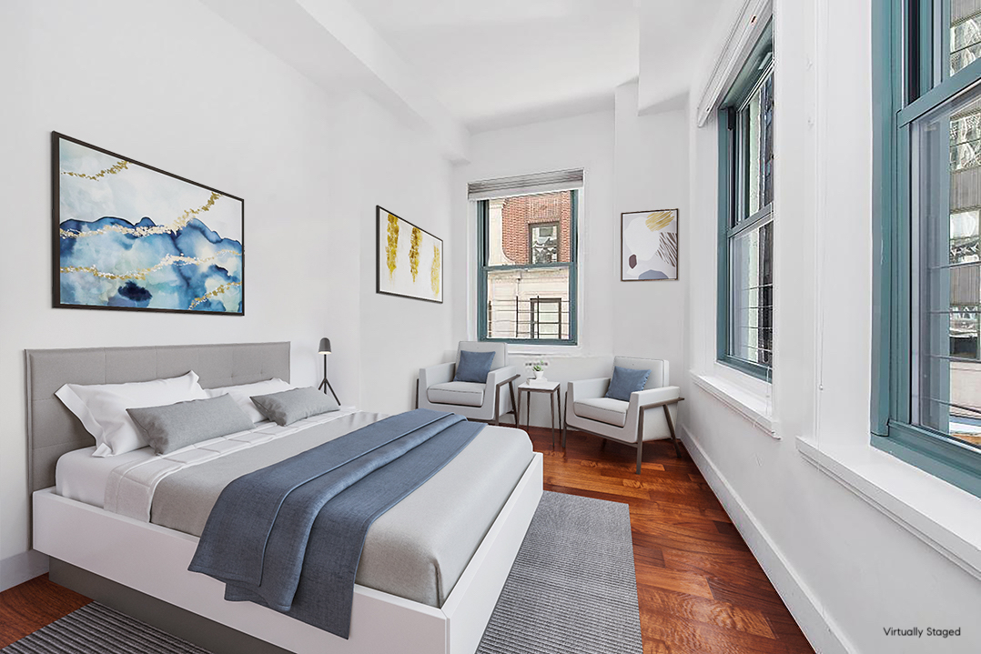 80 John Street, Unit 2F Manhattan, NY 10038 - Photo 6 of 7 a bedroom with a bed and a large window