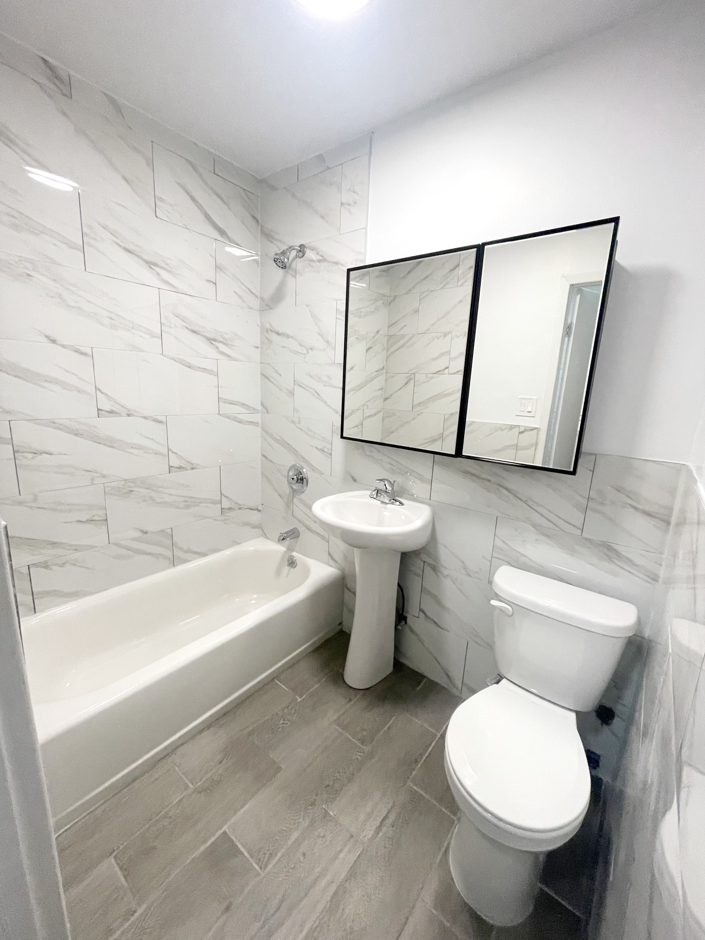 336 East 5th Street, Unit 1RE Manhattan, NY 10003 - Photo 5 of 5 a bathroom with a toilet sink and bathtub