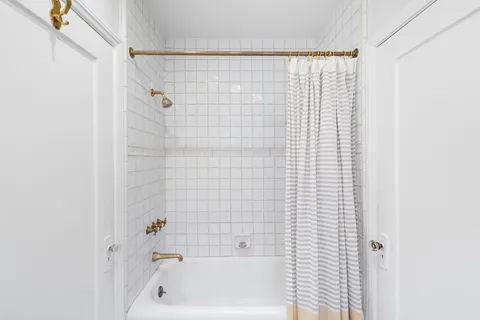 a view of a patio with table and chairs and potted plants