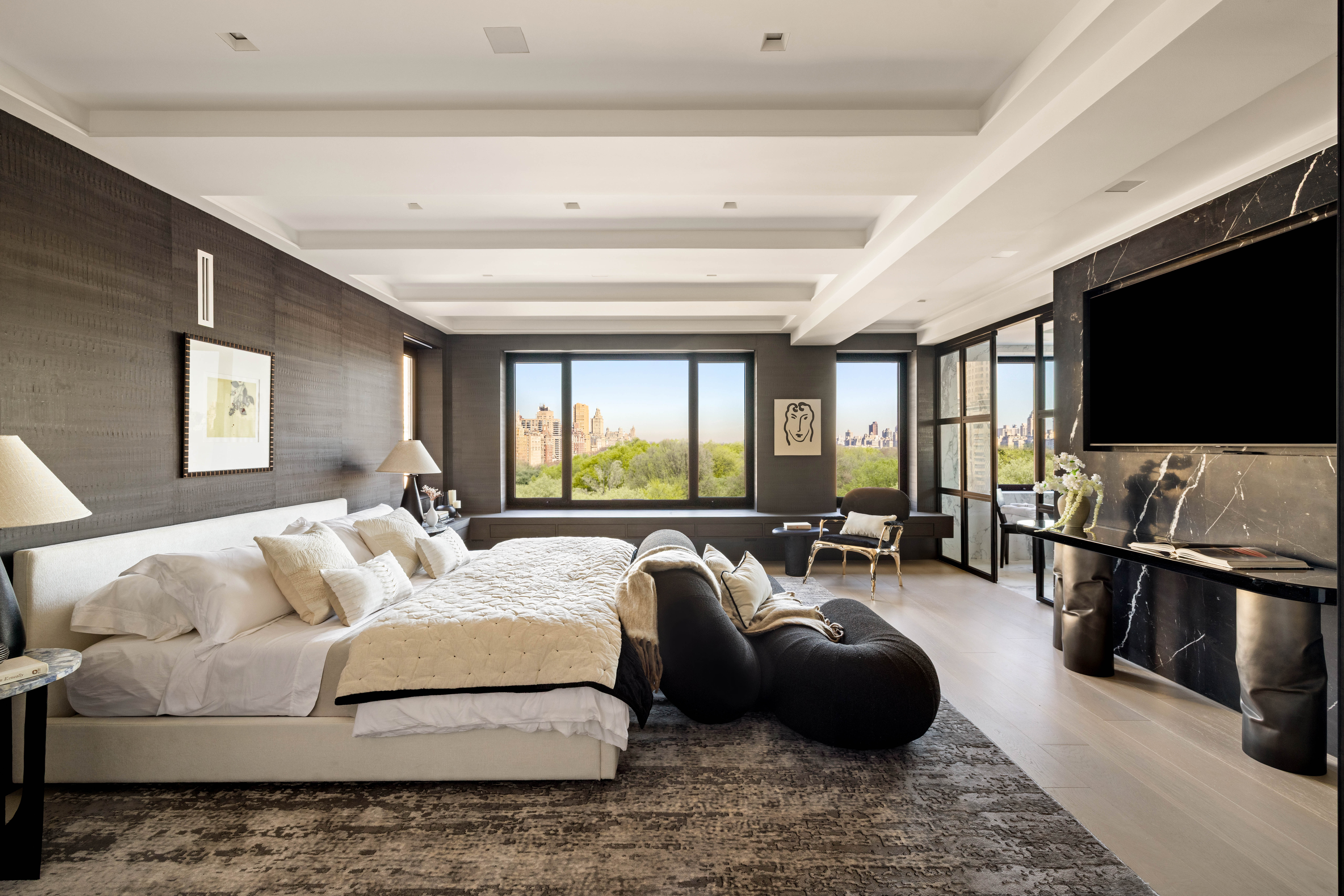 230 Central Park South Manhattan, NY 10019 - Photo 8 of 23 a spacious bedroom with a bed and a flat screen television