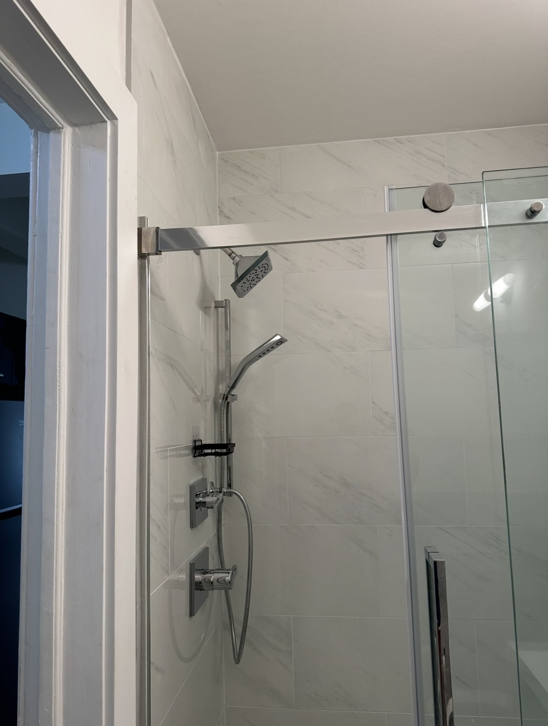 114 East 37th Street, Unit 3A Manhattan, NY 10016 - Photo 15 of 15 a bathroom with a glass shower door