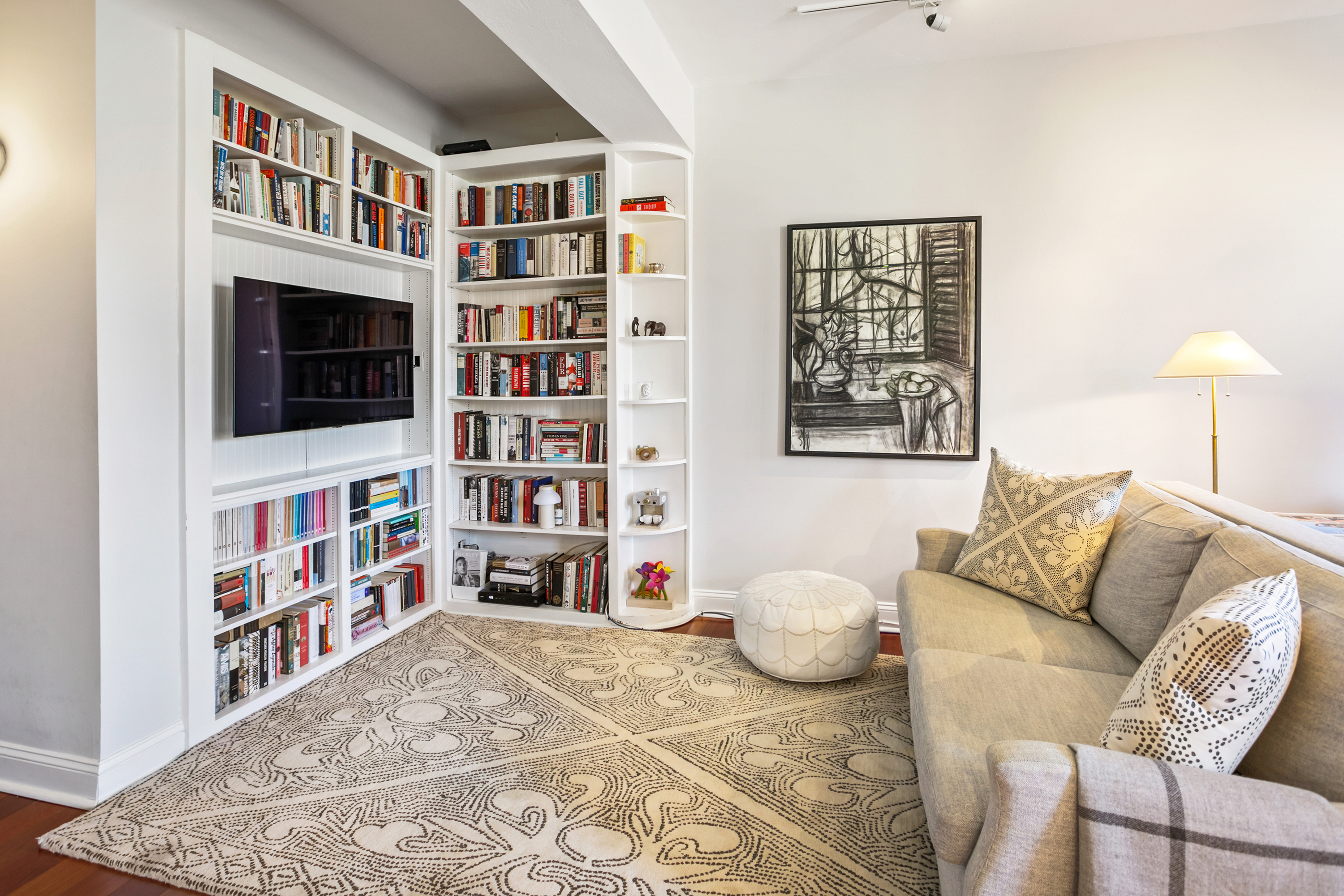 2123 California Street Northwest, Unit D5 Washington, DC 20008 - Photo 9 of 25 a bedroom with furniture and a book shelf