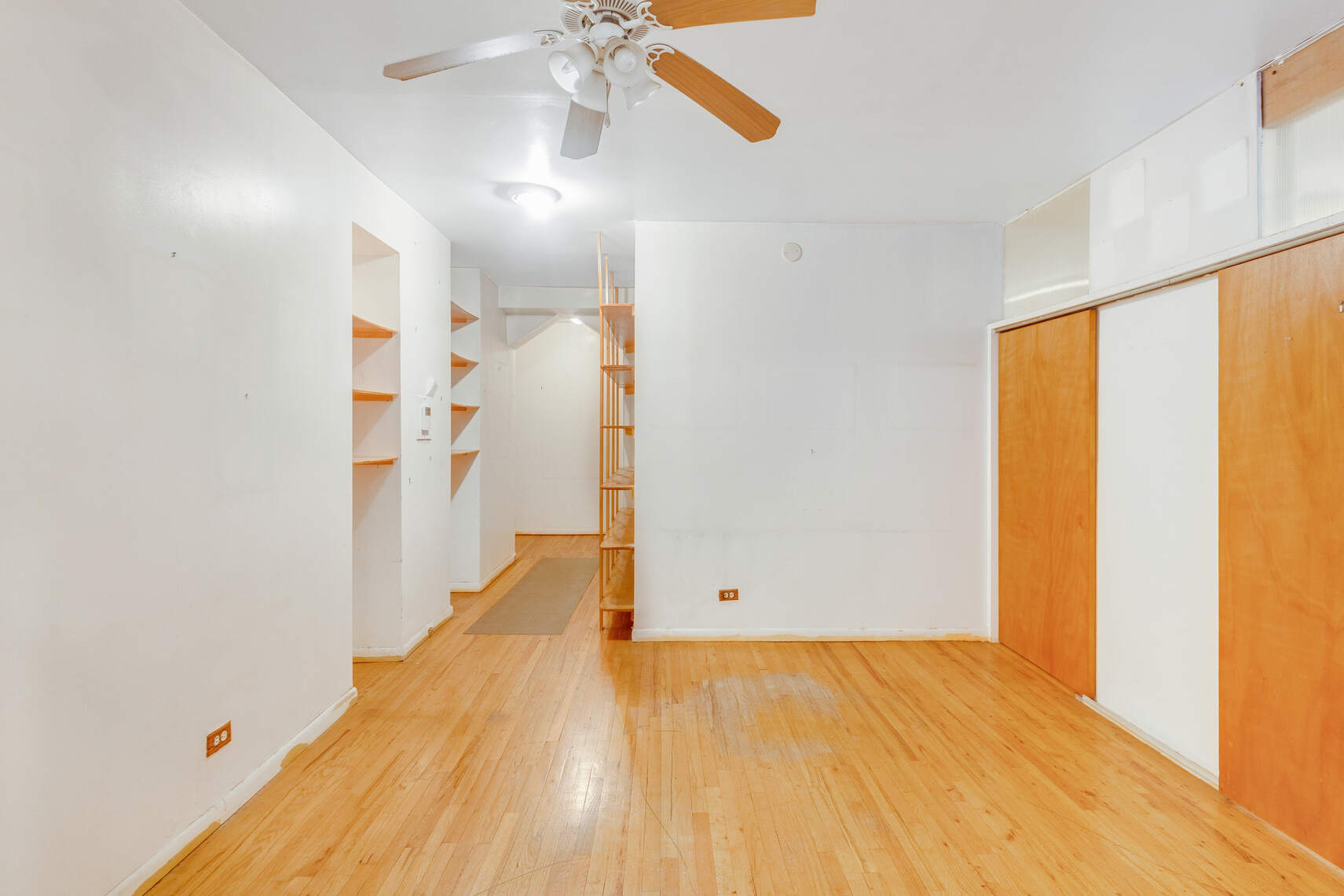 604 Riverside Drive, Unit 1B Manhattan, NY 10031 - Photo 4 of 14 a view of empty room with wooden floor