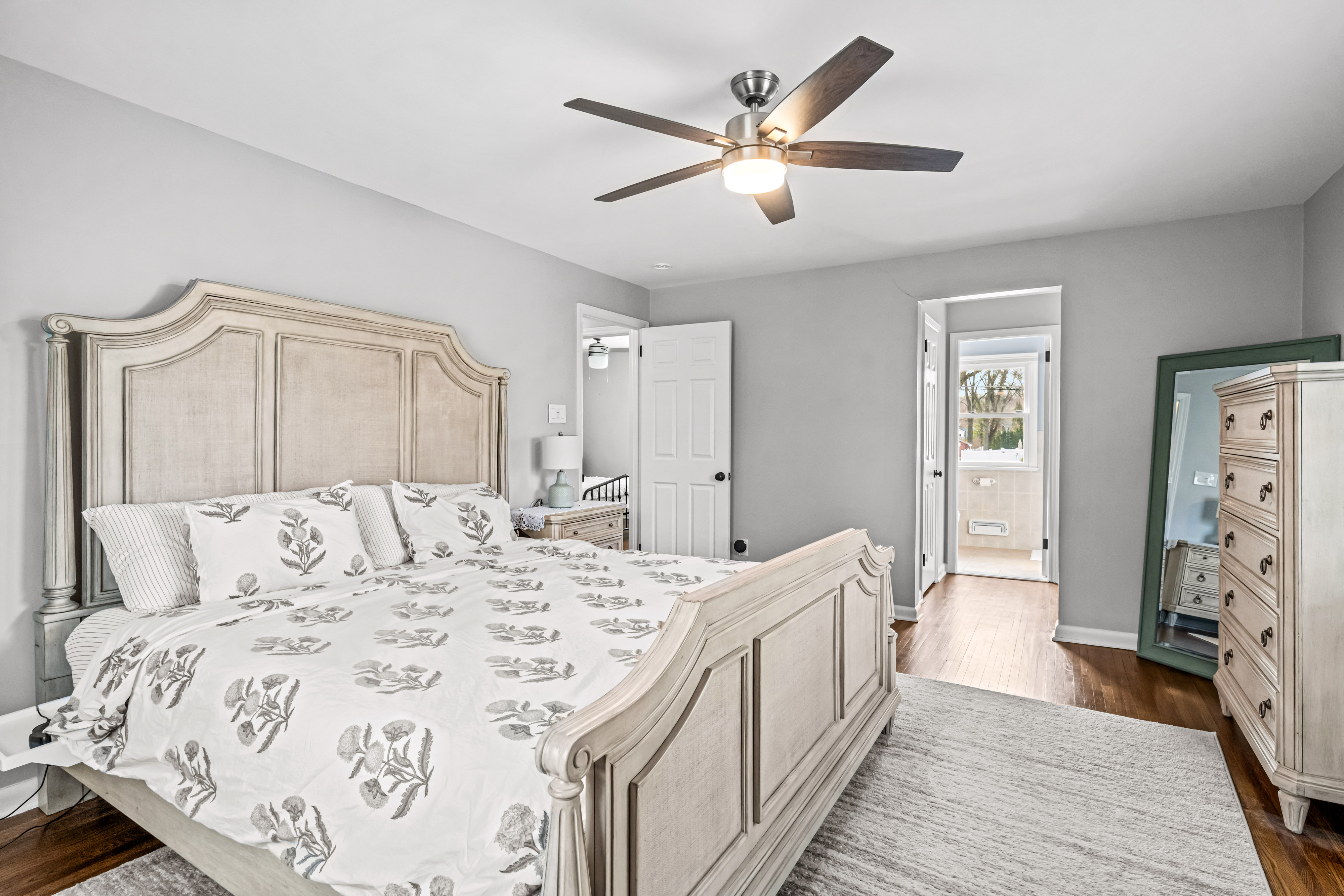 430 Pelham Road Cherry Hill, NJ 08034 - Photo 38 of 48 a spacious bedroom with a large bed and a chandelier