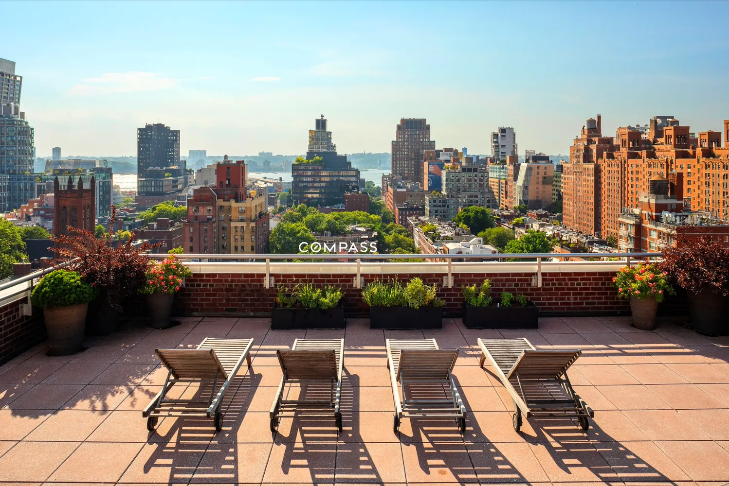 a view of balcony with seating space and city view