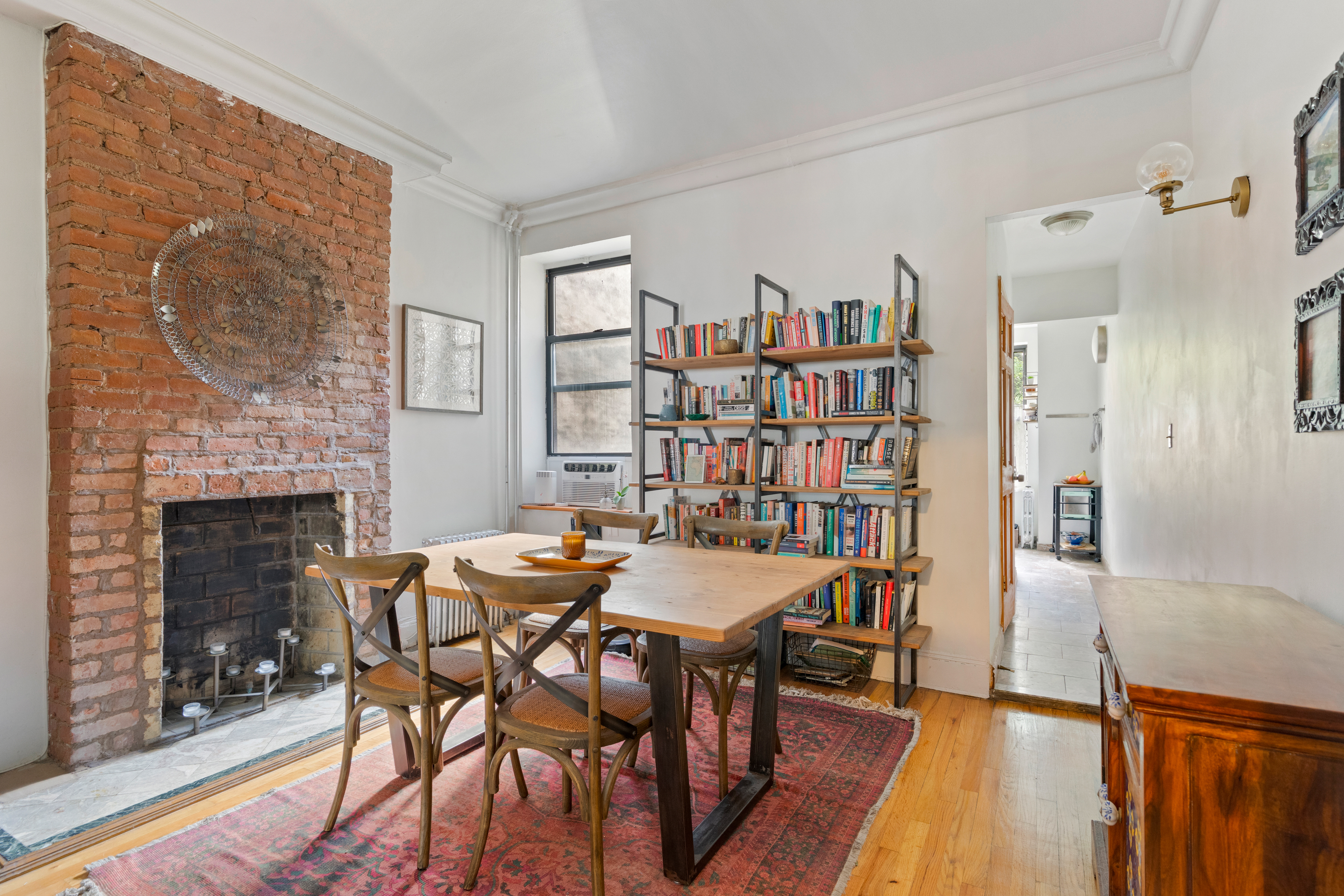 347 5th Avenue, Unit 2L Brooklyn, NY 11215 - Photo 1 of 5 a view of a dining room with furniture and a fireplace