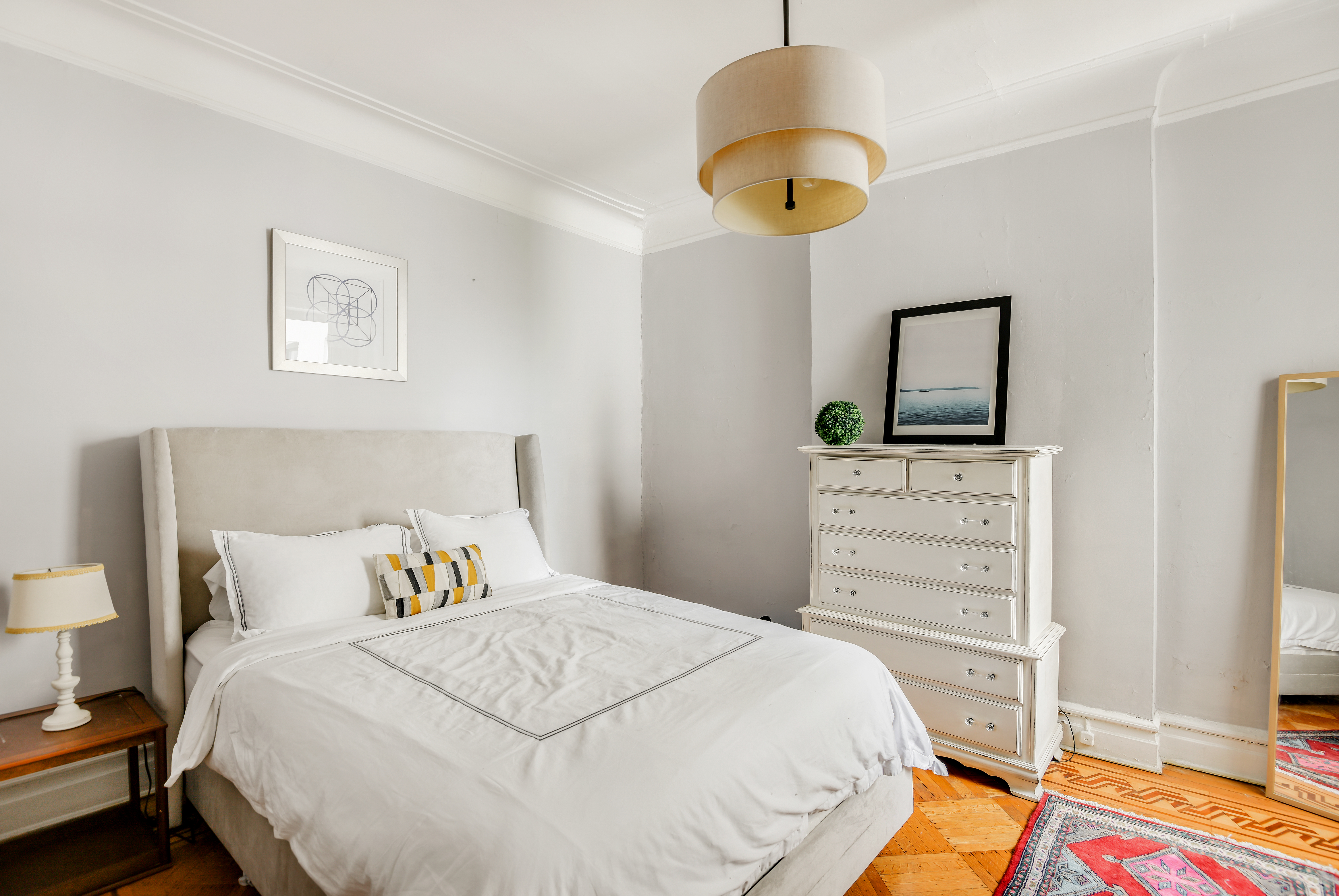 408 8th Avenue, Unit 3B Brooklyn, NY 11215 - Photo 4 of 5 a bedroom with a bed and a chandelier