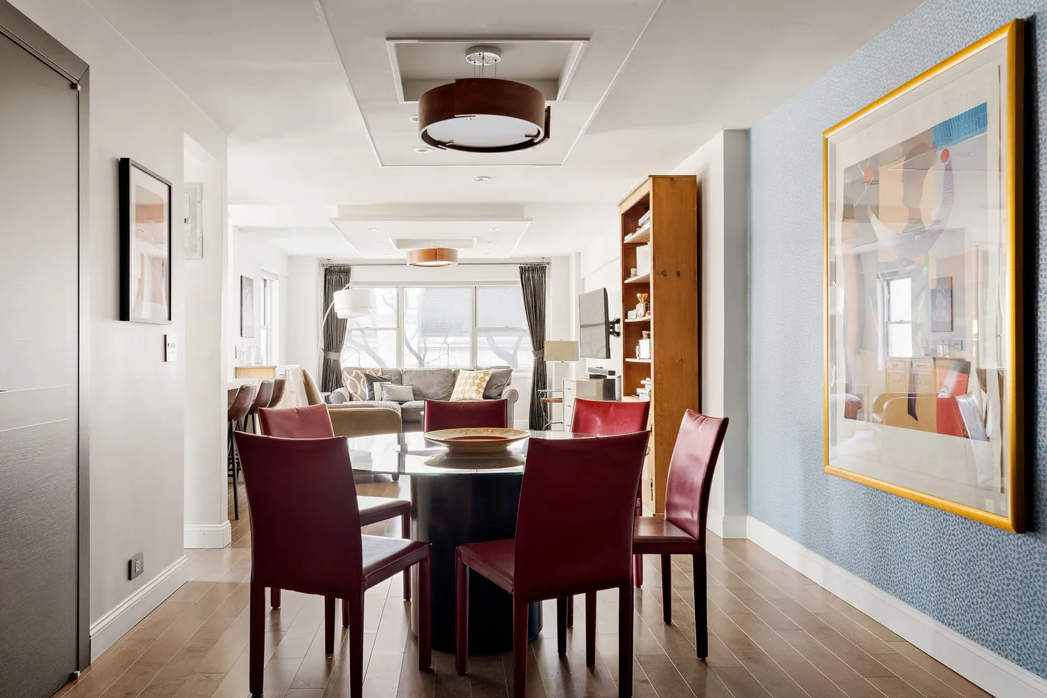 a dining room with furniture and window