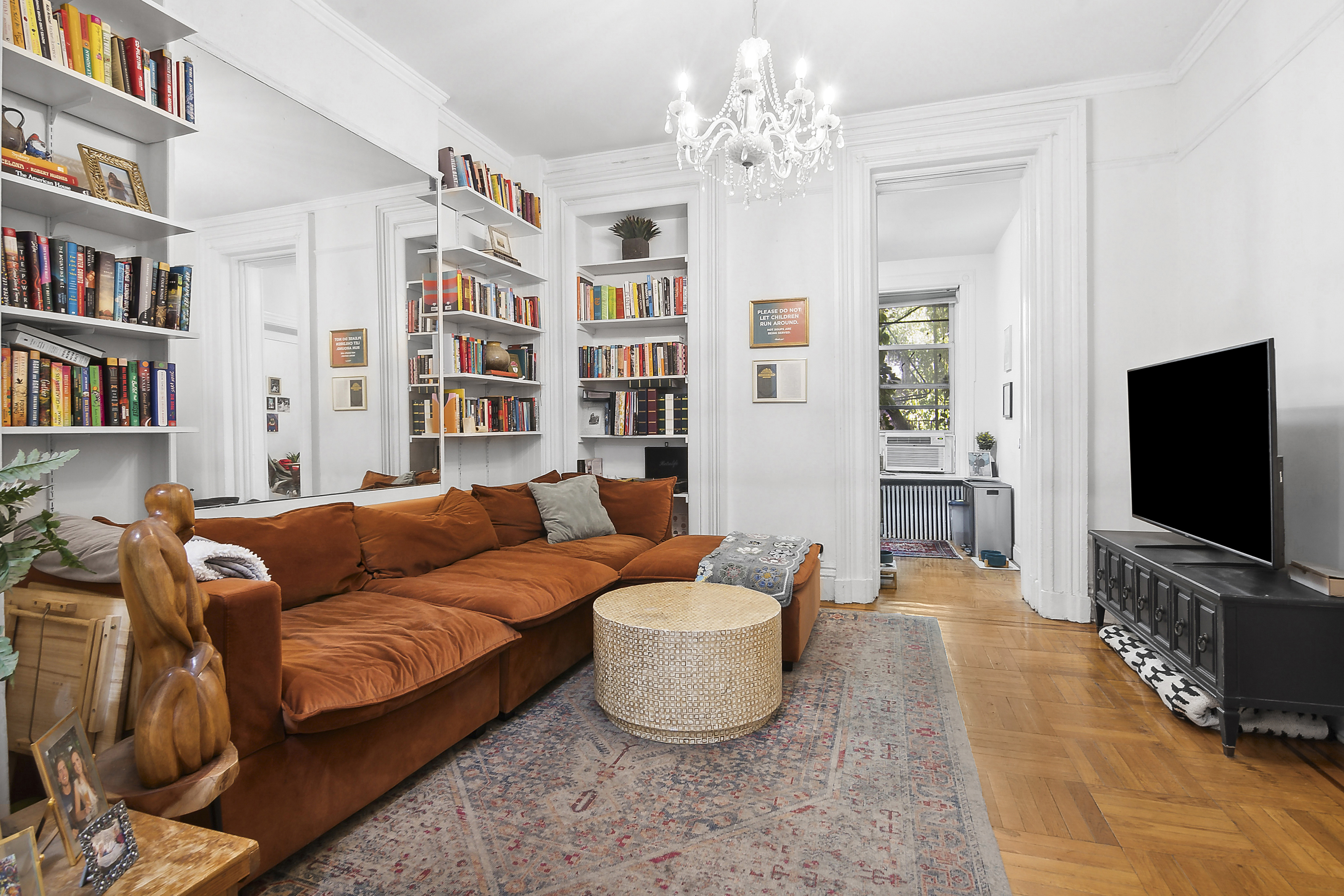 a living room with furniture and a flat screen tv