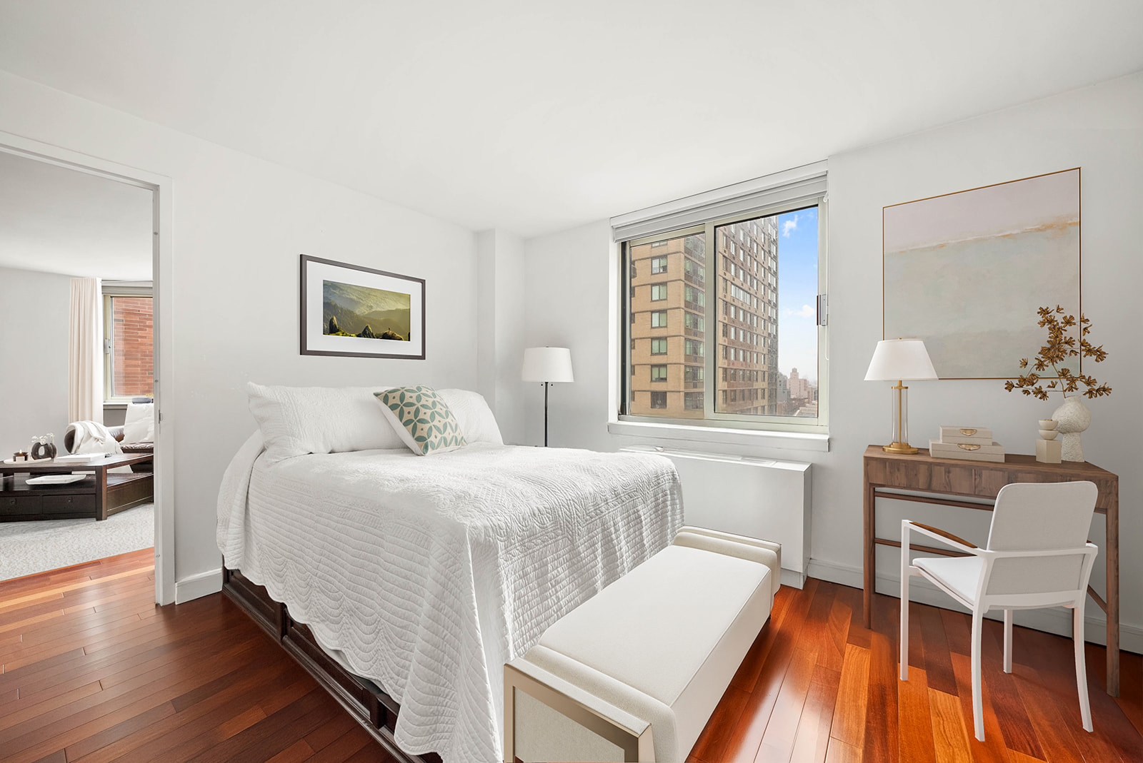 206 East 95th Street, Unit 10B Manhattan, NY 10128 - Photo 6 of 9 a bedroom with a bed and wooden floor