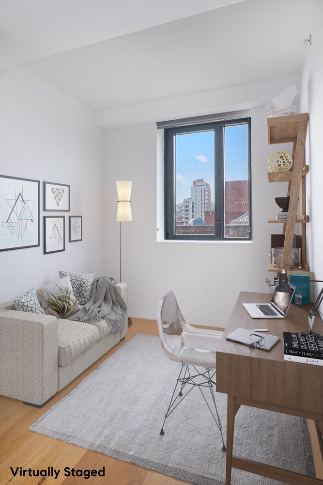 23 West 116th Street, Unit 8A Manhattan, NY 10026 - Photo 17 of 28 a living room with furniture and wall paintings