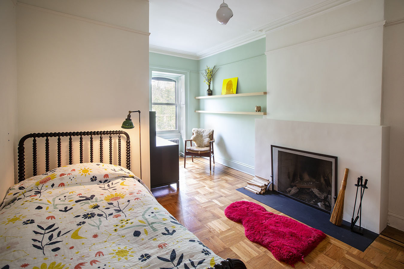 124 Park Place, Unit TRIPLEX Brooklyn, NY 11217 - Photo 7 of 15 a bedroom with a bed and a fireplace