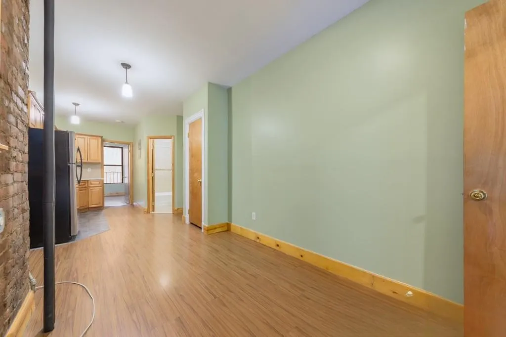 a view of a livingroom with wooden floor