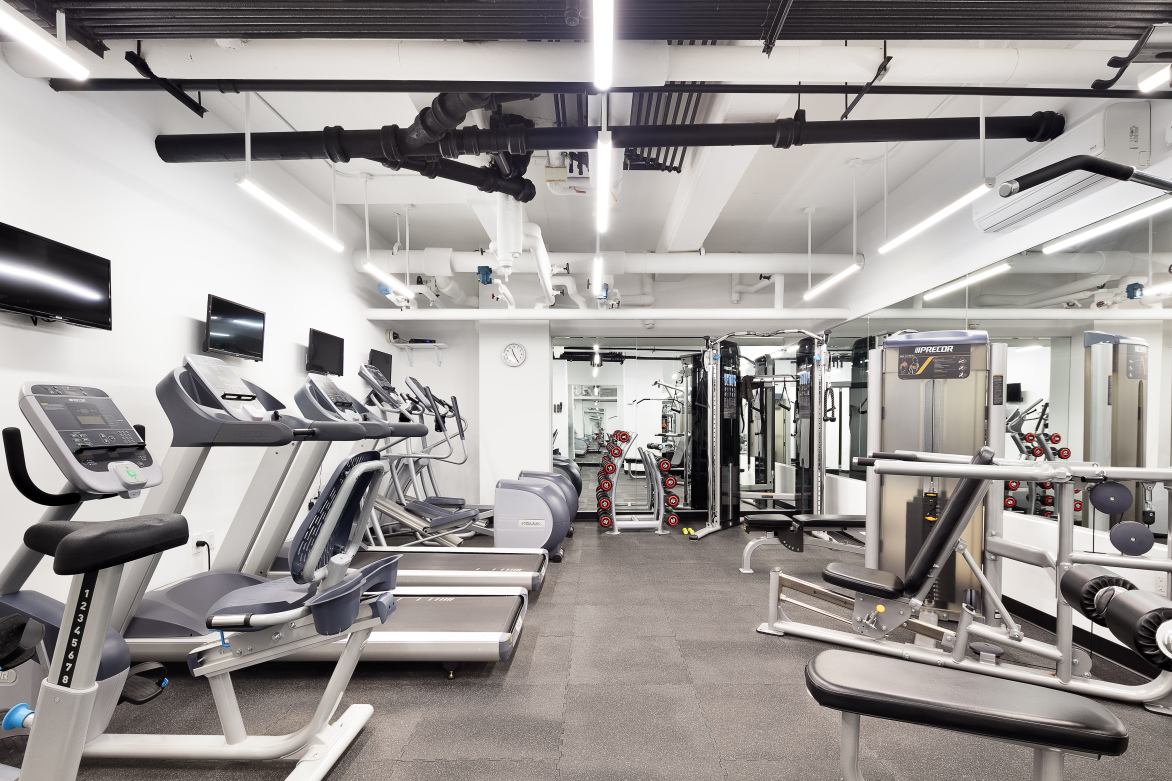 36 Sutton Place South, Unit 10B Manhattan, NY 10022 - Photo 14 of 16 a view of a room with gym equipment