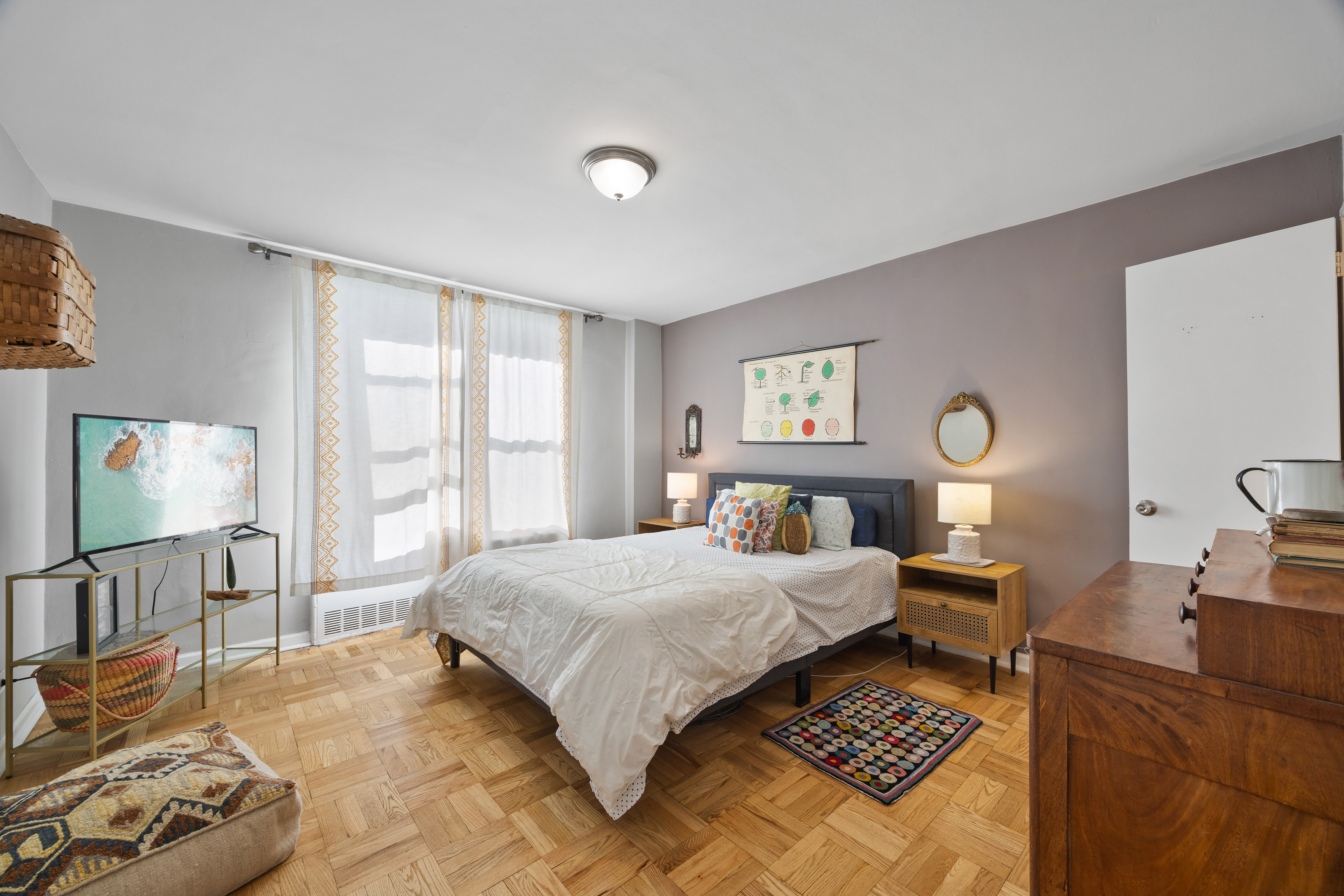 255 Fieldston Terrace, Unit 2L Bronx, NY 10471 - Photo 19 of 32 a bedroom with a bed and wooden floor