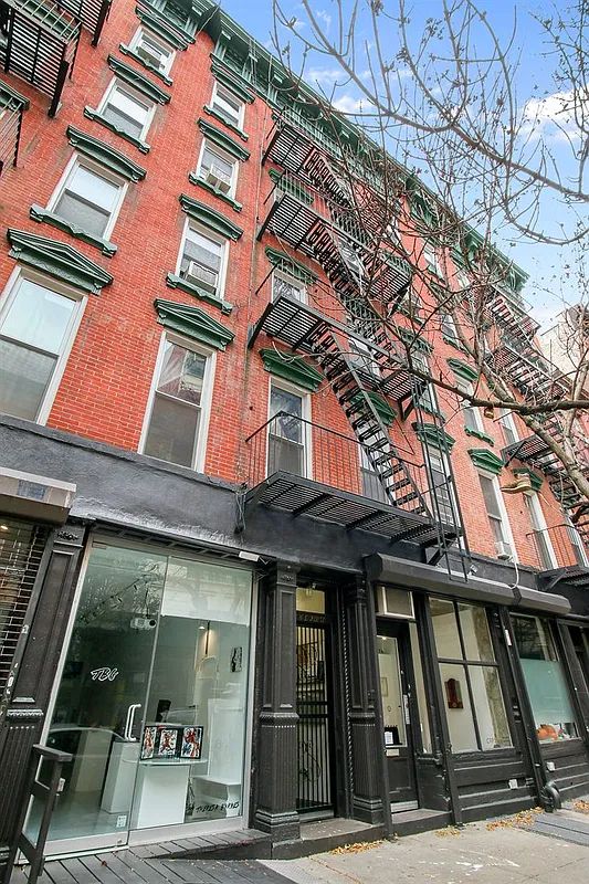 a view of brick building with many windows