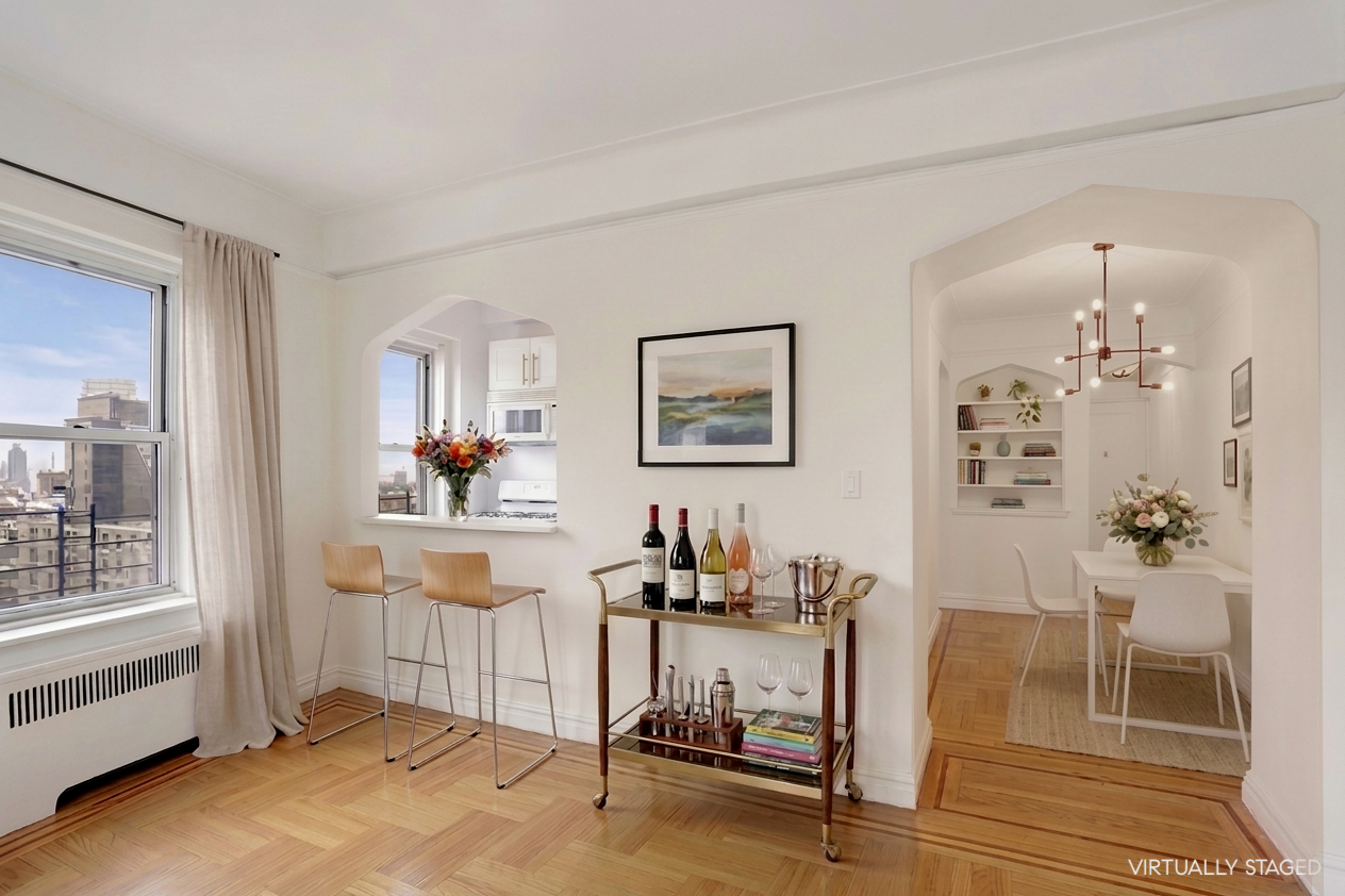 250 Cabrini Boulevard, Unit 9E Manhattan, NY 10033 - Photo 4 of 19 a view of a livingroom with furniture and a window